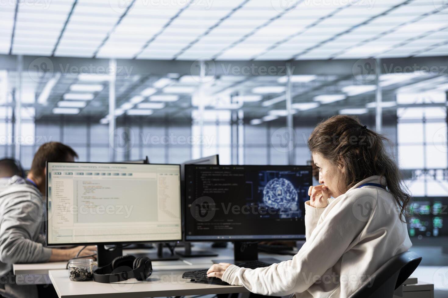 Computer scientist doing data center automation using AI and machine learning tools. IT expert integrating artificial intelligence driven automation in server hub operations photo