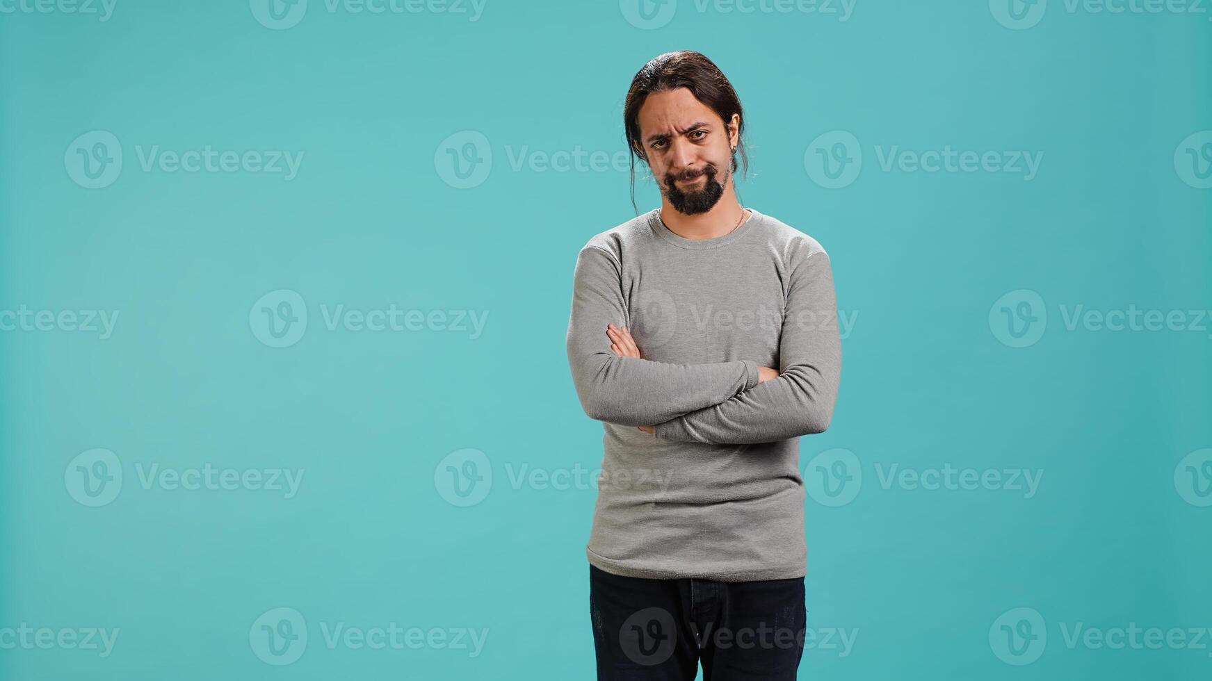 Man shakes head, showing negative emotion, showing lack of satisfaction, isolated over studio background. Irked person disagreeing with friend during conversation, studio backdrop, camera A photo