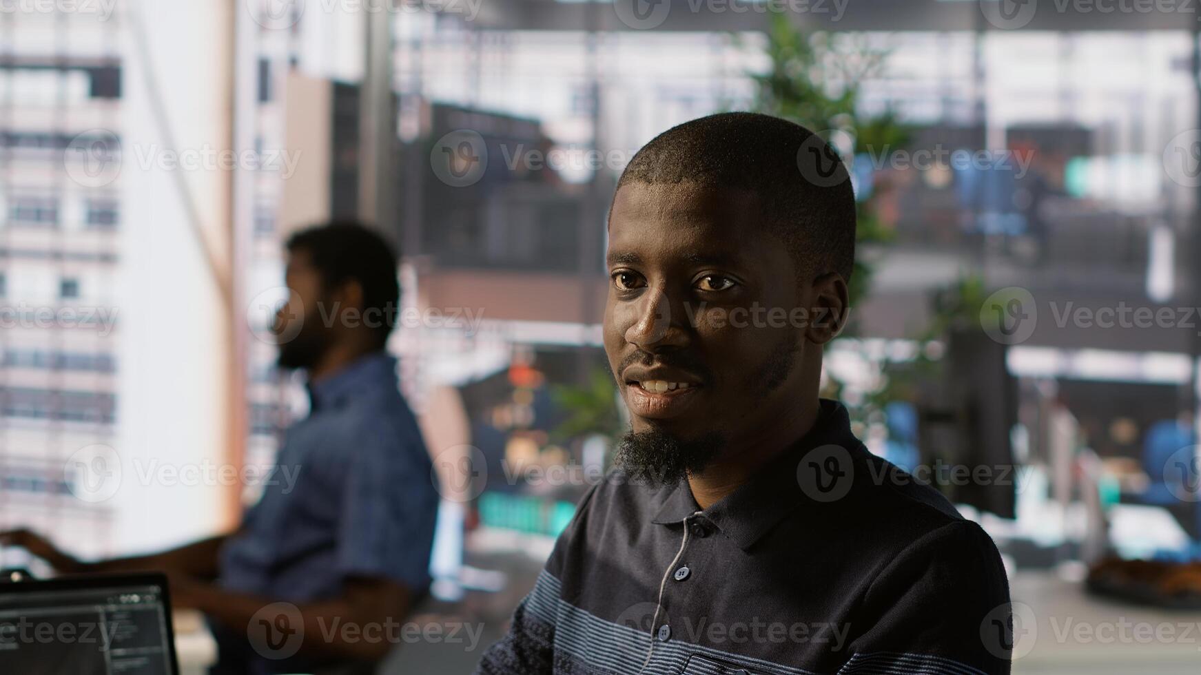 Portrait of happy programmer working with machine learning artificial intelligence critical to autonomous systems. Upbeat software engineer transforming data into predictive models, camera A photo