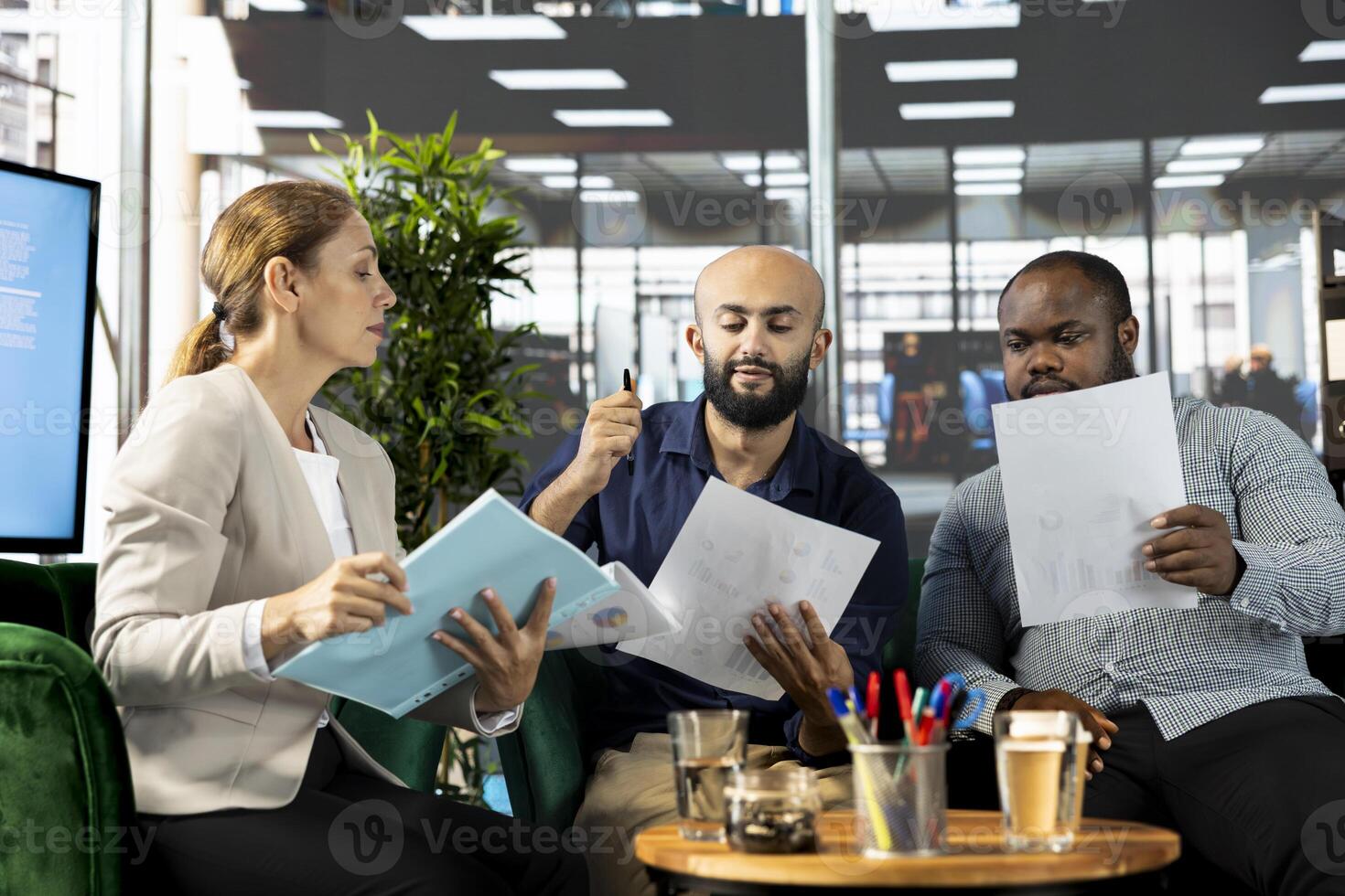 Manager with employees developing and implementing business strategies to improve operational efficiency and profitability. Company director setting key revenue performance targets photo
