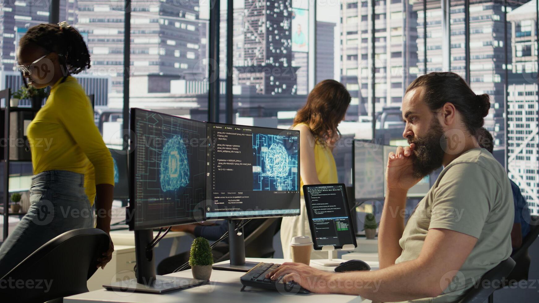 Employee utilizing AI resources and platforms to train and deploy machine learning models, handheld camera shot. Man monitoring and maintaining artificial intelligence company systems, camera B photo