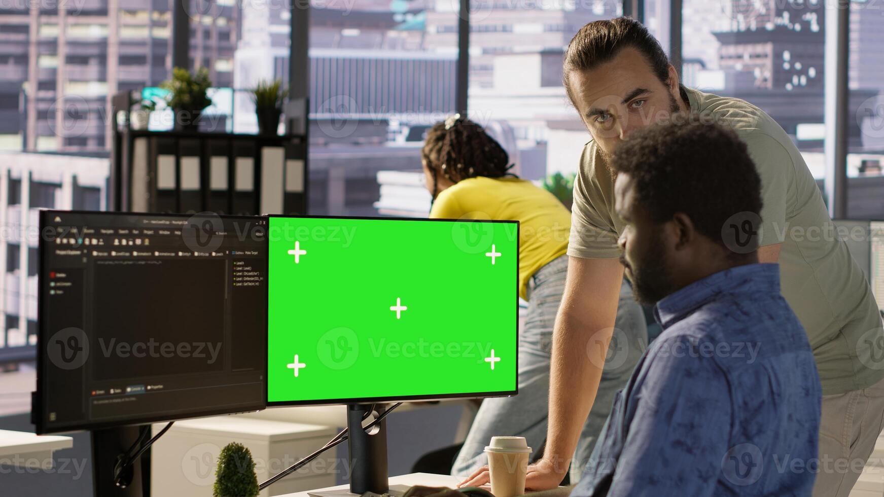 Admin doing software debugging on green screen PC, asking for help from coworker, checking errors in code. Worker fixing coding mistakes on mockup computer, being assisted by colleague, camera A photo