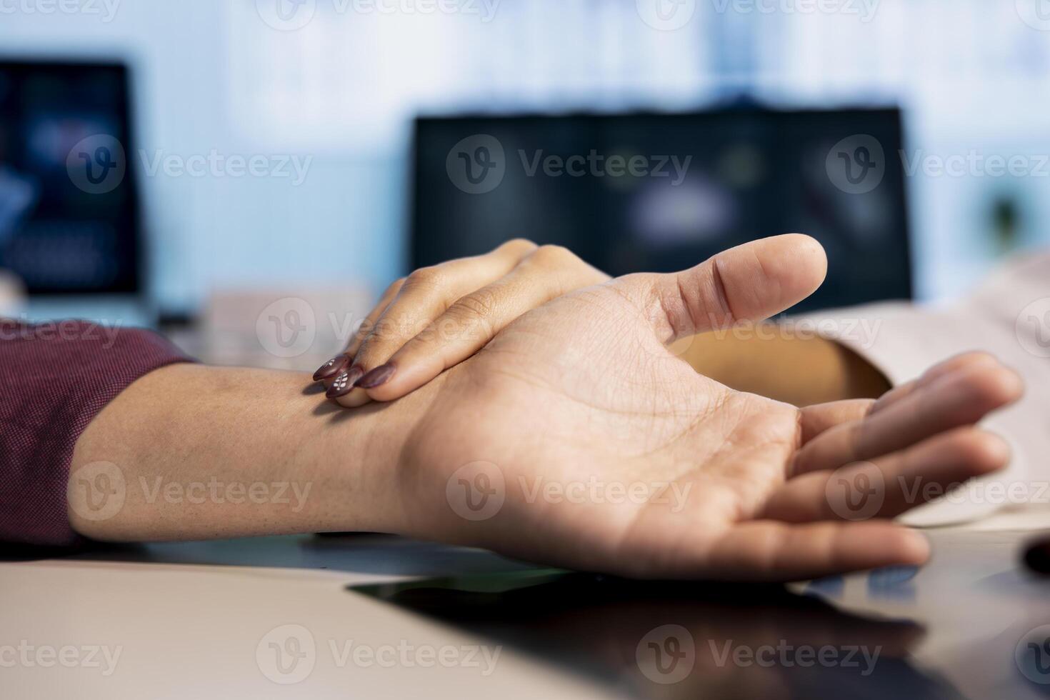 Physician uses smartwatch to check patient pulse in a healthcare visit, diagnostic tools. Doctor reviewing comprehensive heart rate monitoring during checkup, professional diagnostics. Close up. photo