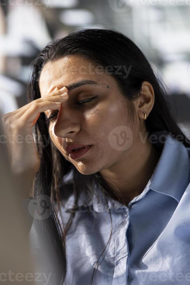 CEO feeling the anxiety of business pressure and project failure, managing multiple financial objectives. Stress mounts as she faces tough challenges and the disappointment of unmet goals. photo