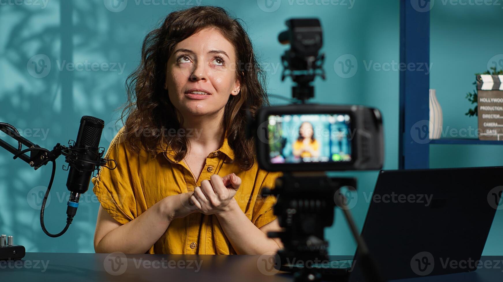 Content creator filming technology review of different electronics, unboxing them and presenting specifications to audience. Media star showing product recommendations to subscribers, camera A photo