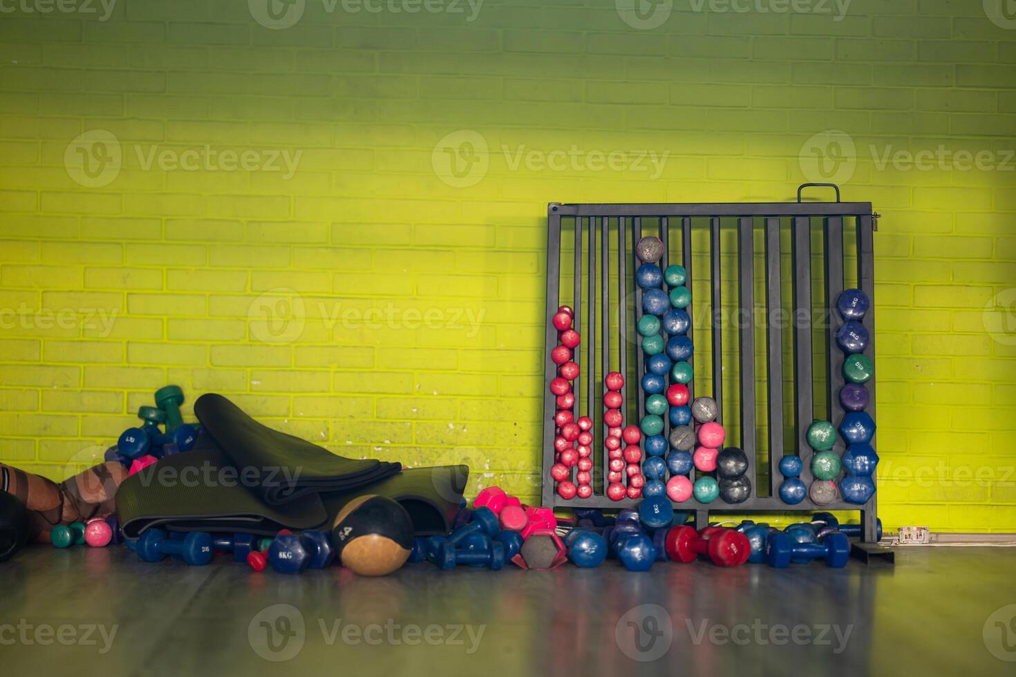 A pair of dumbbells neatly arranged in the gym, ready for a powerful workout session to build strength and endurance photo