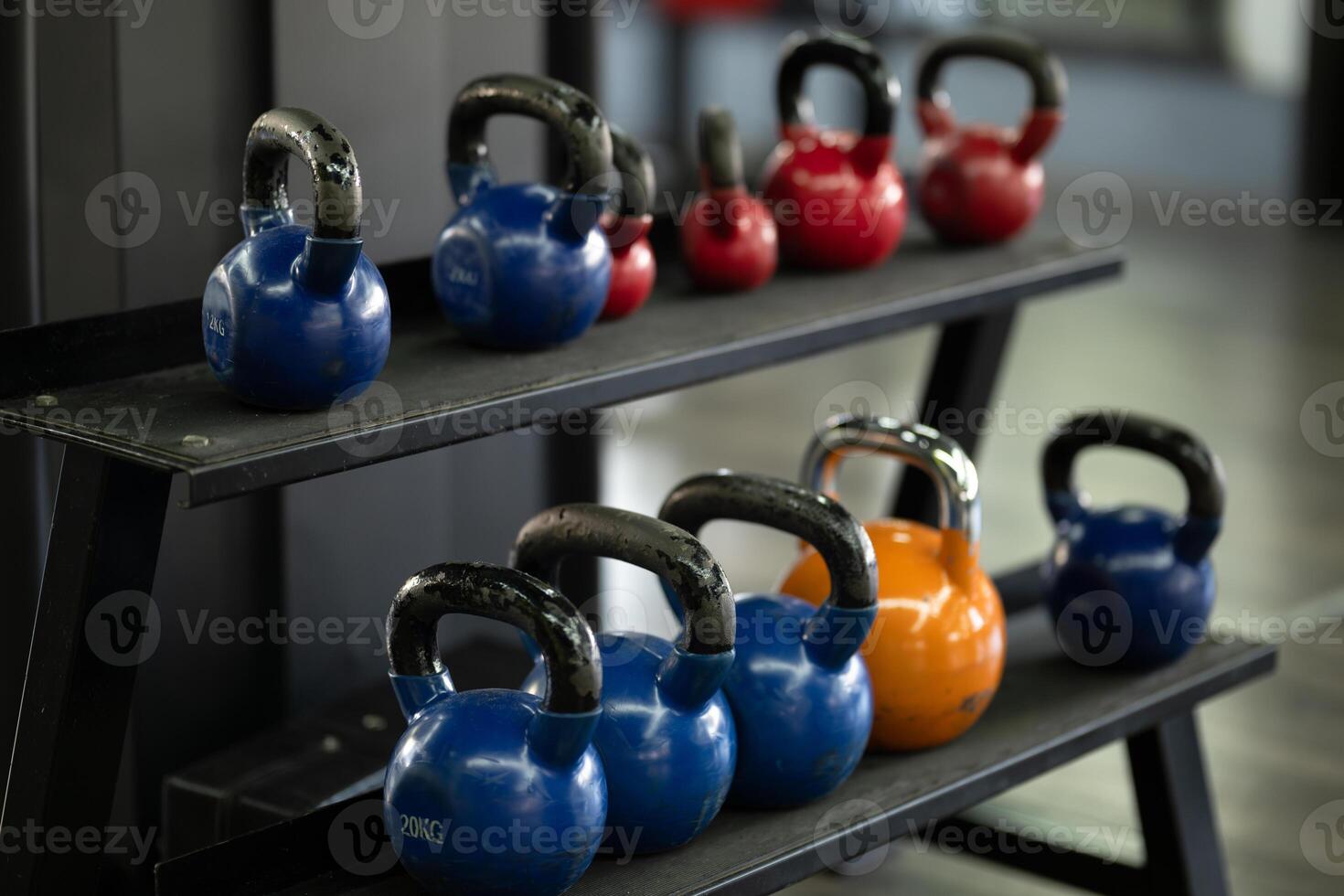 A pair of dumbbells neatly arranged in the gym, ready for a powerful workout session to build strength and endurance photo