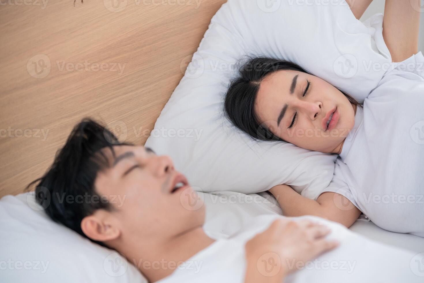 People sleeping peacefully in a cozy bedroom with soft pillows and a calming atmosphere early in the morning photo