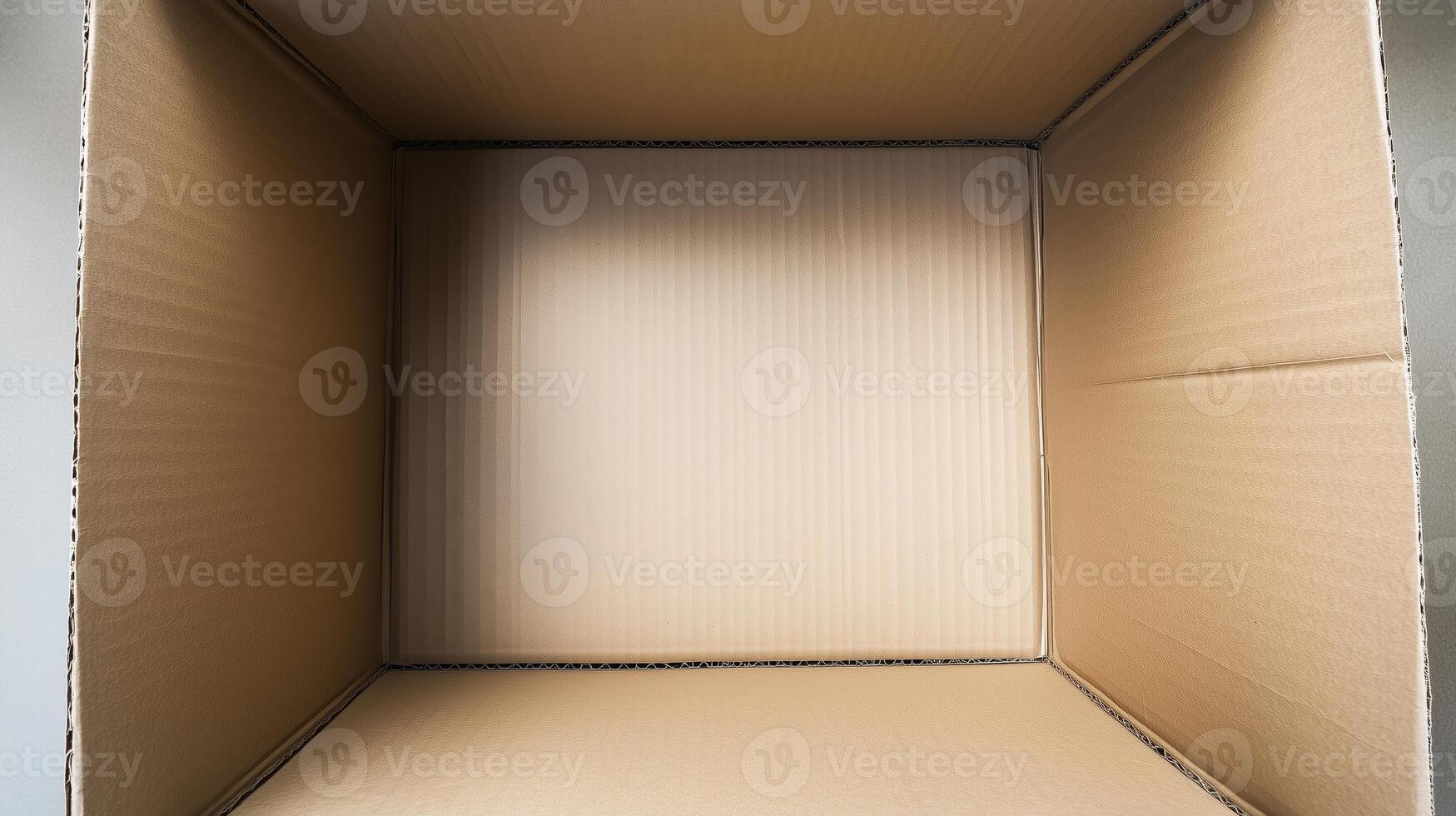 An open cardboard box with vertical deep walls viewed from the top. 16 photo
