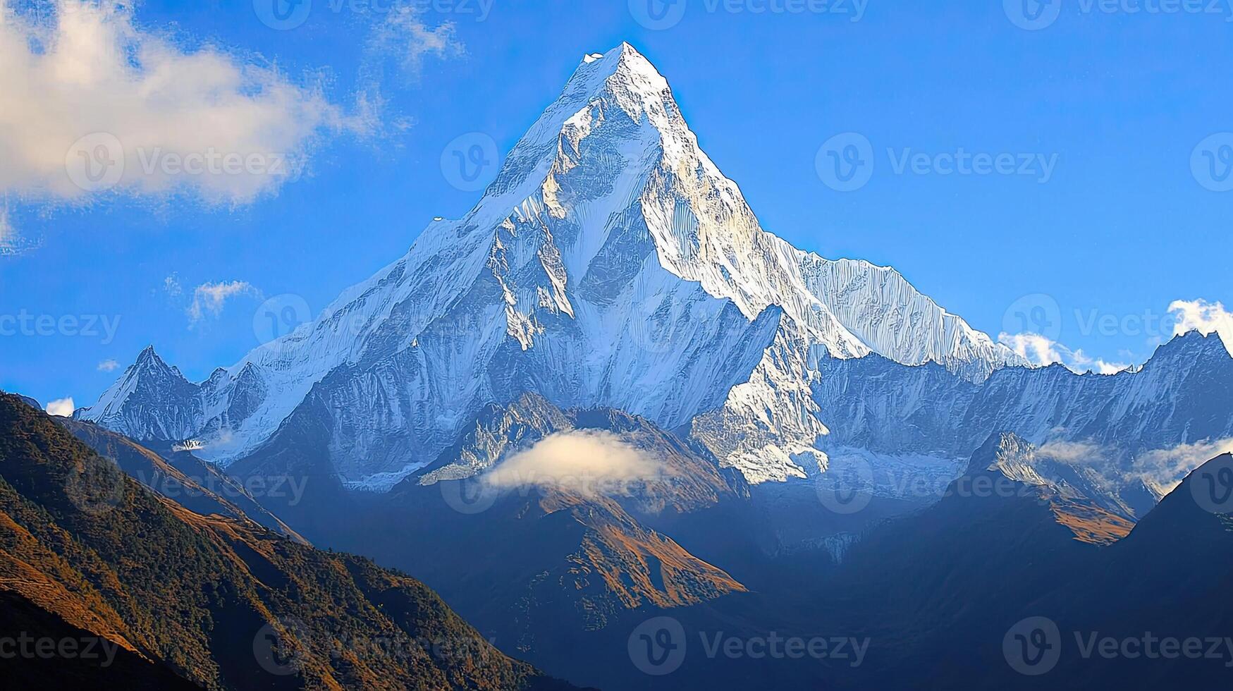 Snow Capped Mountain Peak Under Clear Blue Sky And Few Clouds At Daytime Picturesque Highland Scenery photo