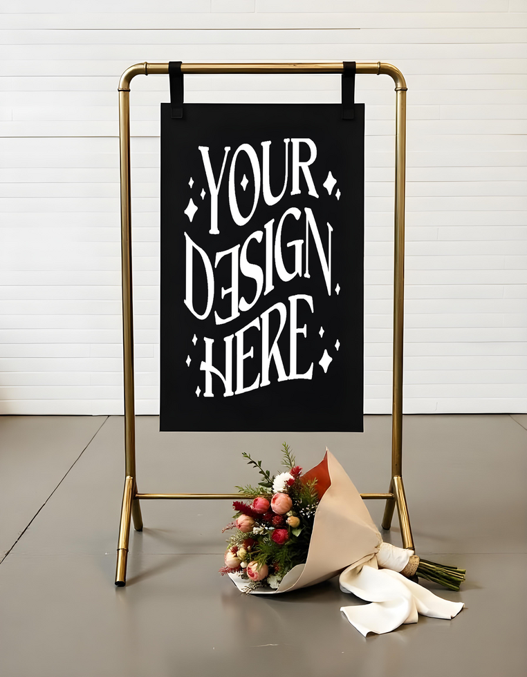 A mockup black poster hanging from a golden metallic structure with a bouquet of flowers psd