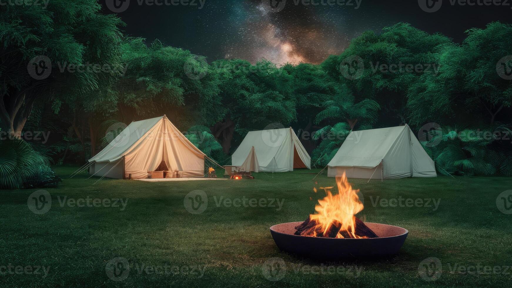 serene night scene in a lush green forest, showing a cozy campsite with tents and a crackling fire photo