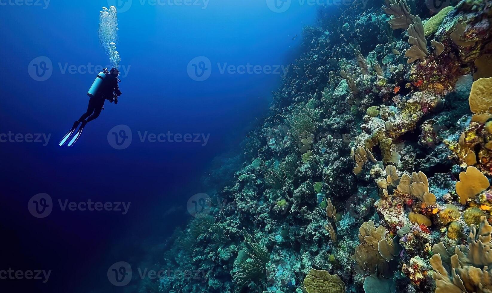 Scuba diving, underwater diver swimming inside Great Blue Hole sinkhole with oxygen tanks and gear. Belize, recreational tourism, copy space, deep photo