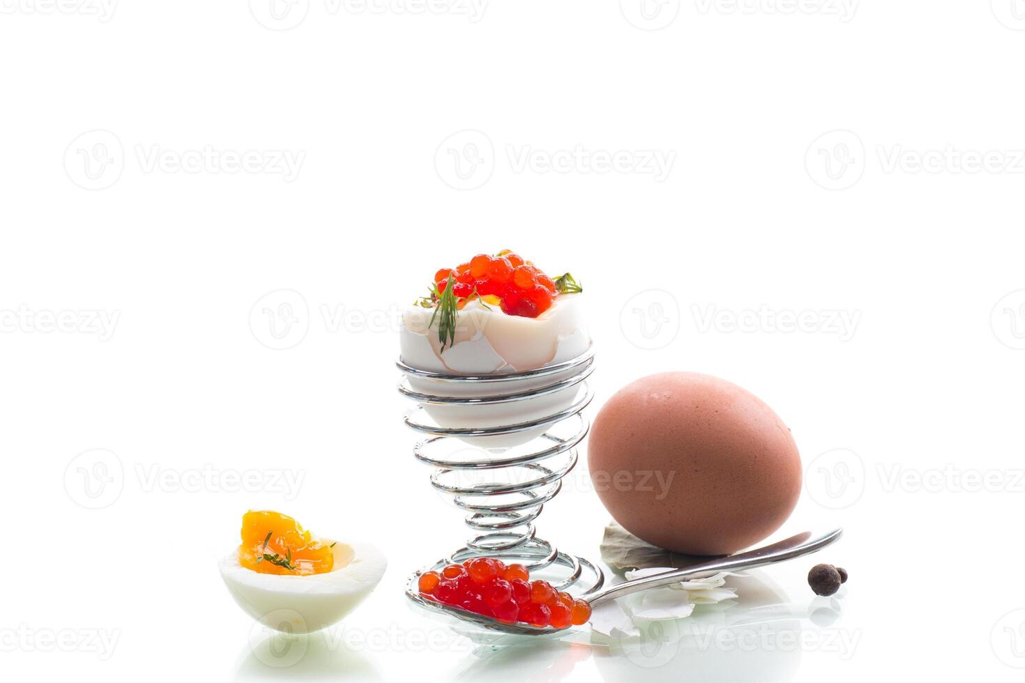 Breakfast with red caviar and boiled egg, isolated on white background photo