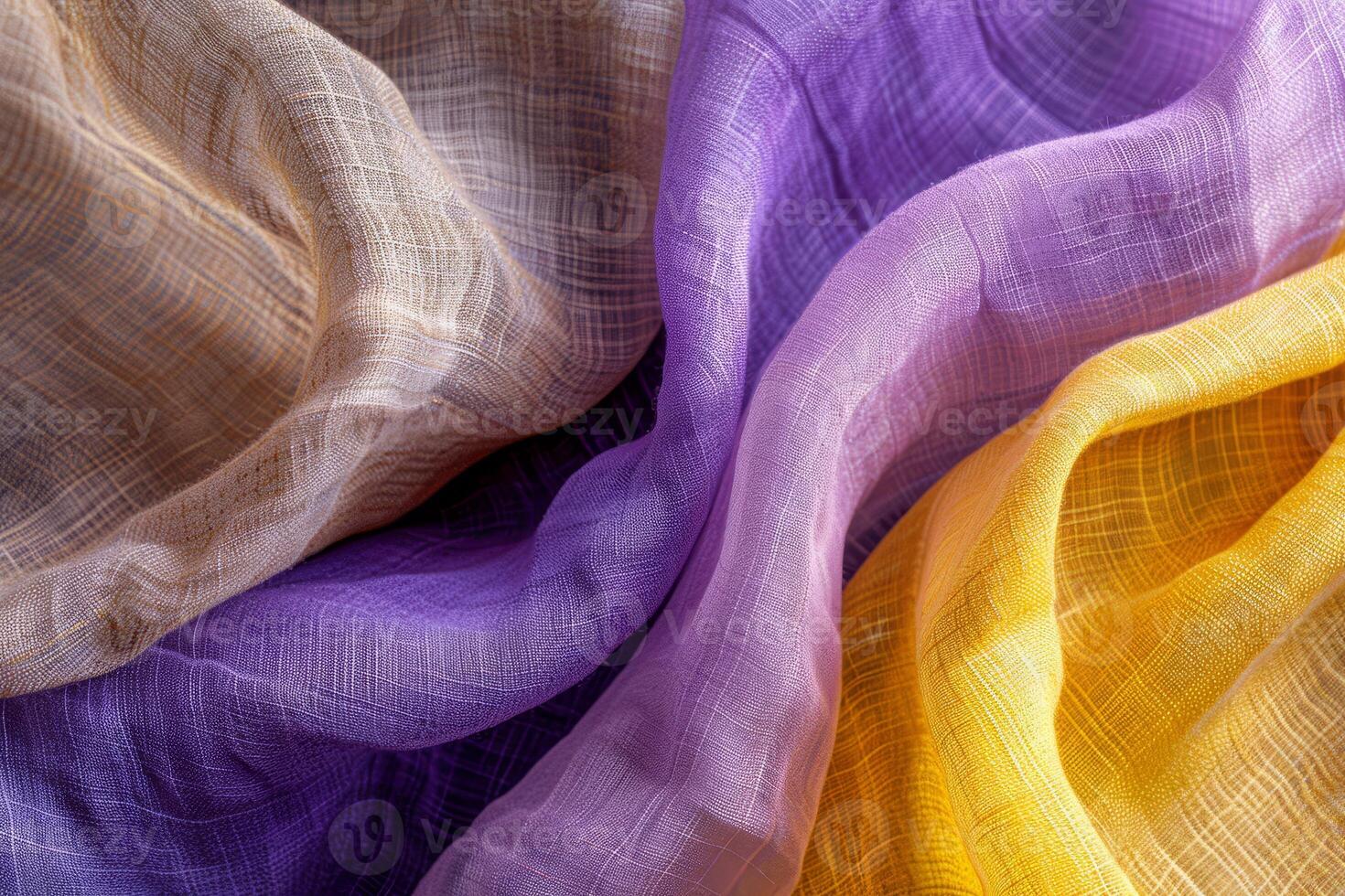Close-up view reveals the intricate textures and rich colors of linen as it elegantly overlaps, creating an artistic tapestry of fabric photo