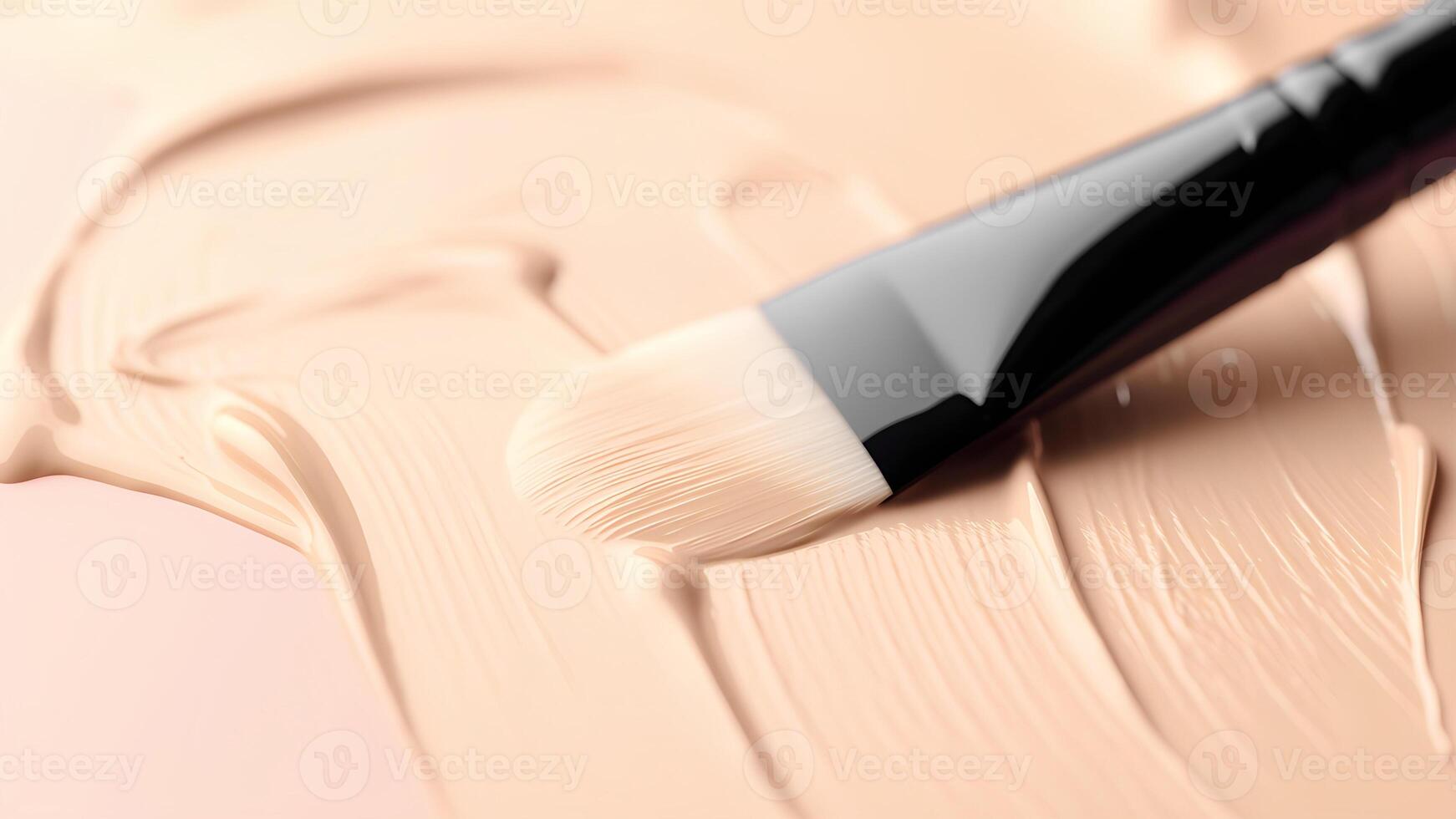 A makeup brush is sitting on top of a foundation photo