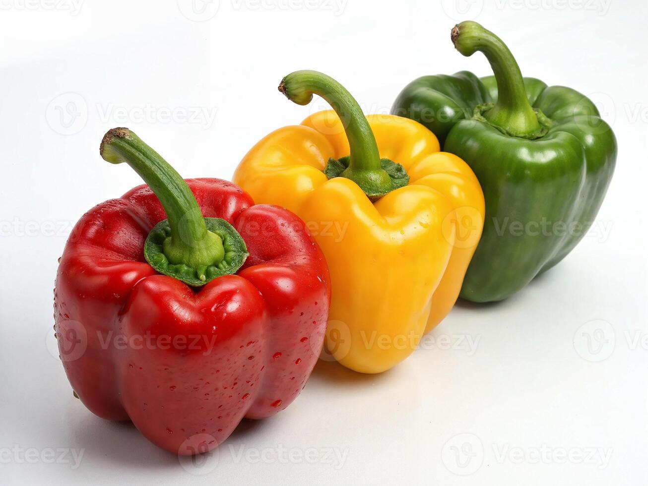 Colorful bell peppers displayed on a white surface illustrating freshness and variety photo