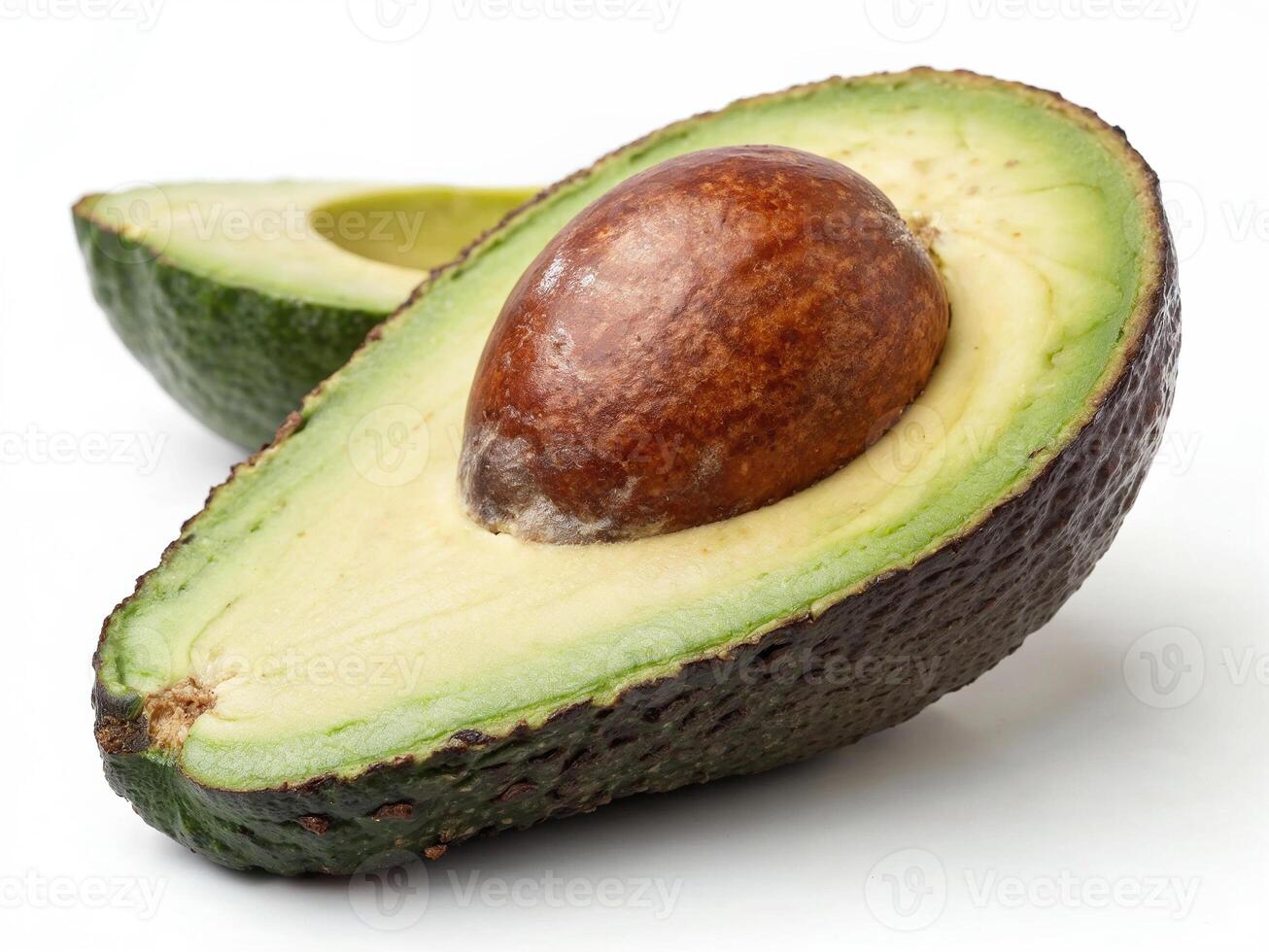 Ripe avocado half showcasing its creamy flesh and large seed in a bright setting photo