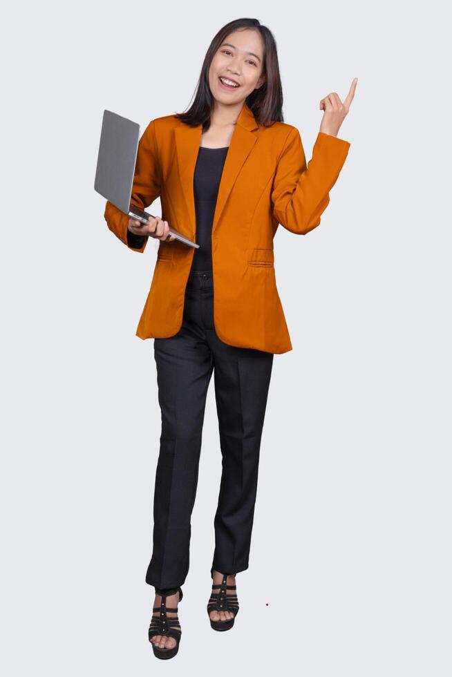 Full Body Portrait of Young Female Office Worker Holding Laptop Isolated On White Background photo