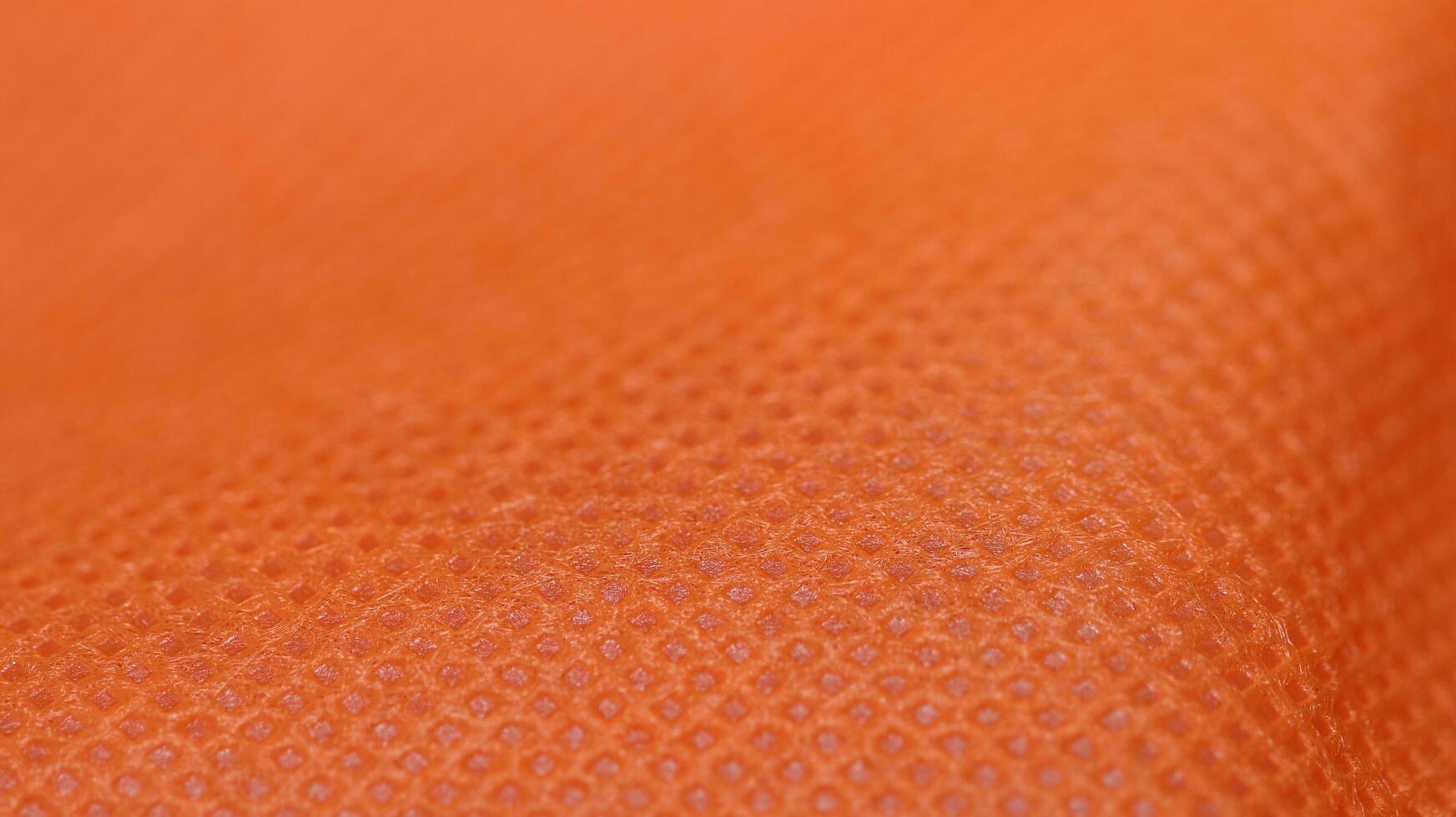 Extreme Closeup of Vibrant Orange Fabric photo