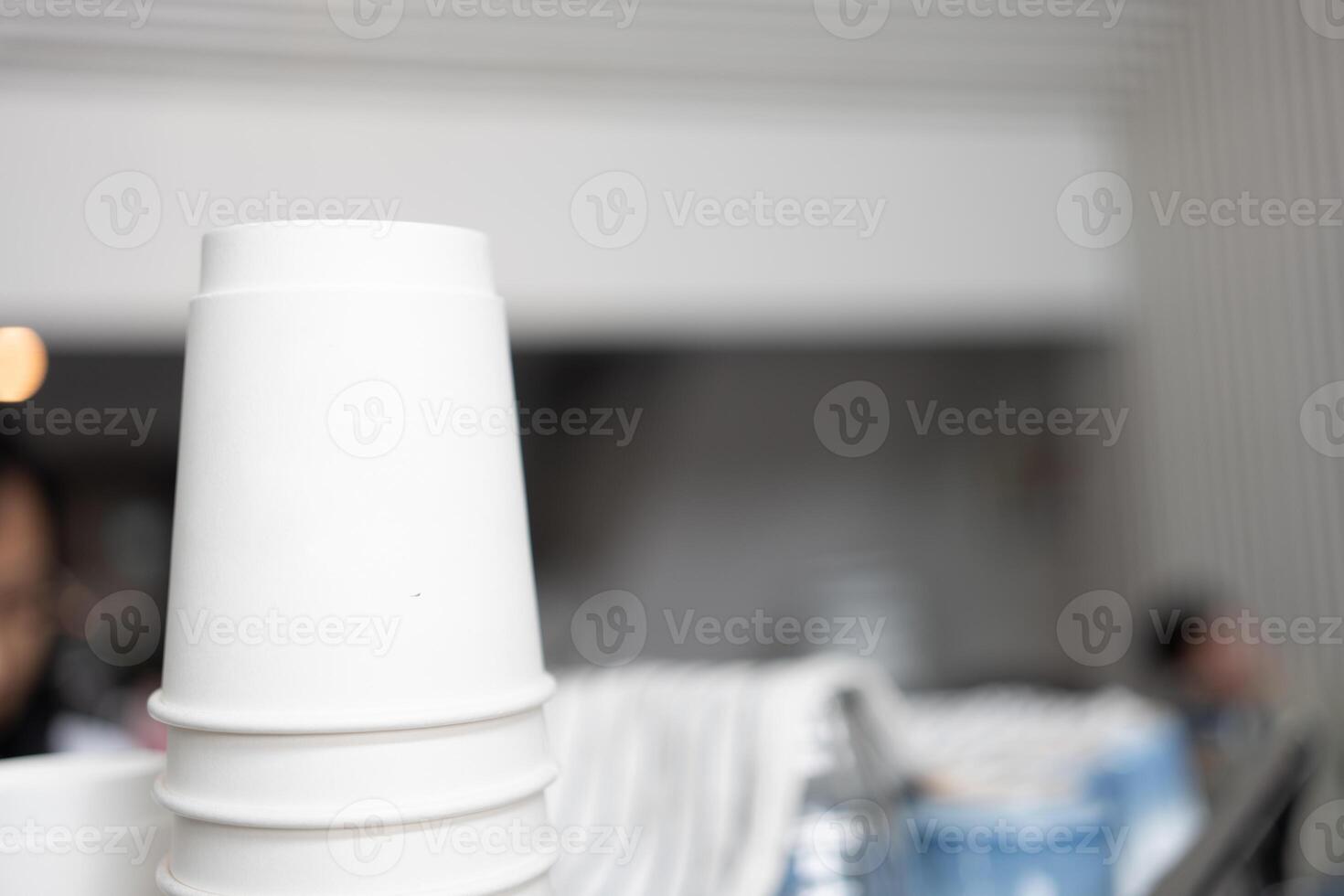 Lovely coffee glasses are standing on the top of the coffee machine photo