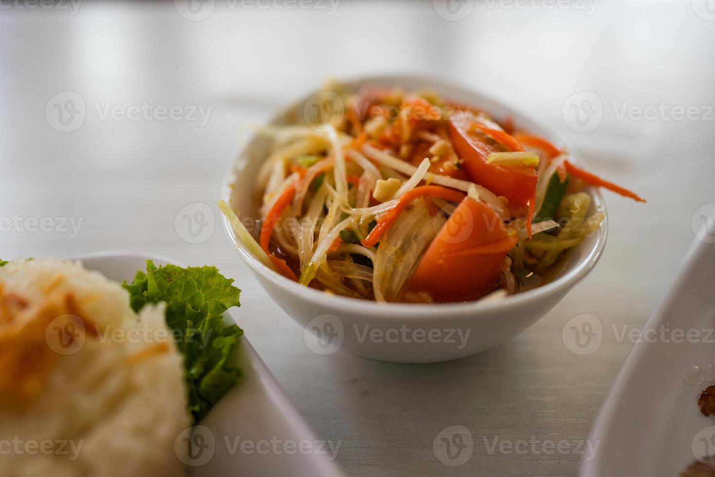 Papaya salad yummy or somtum is a spicy Thai foods photo