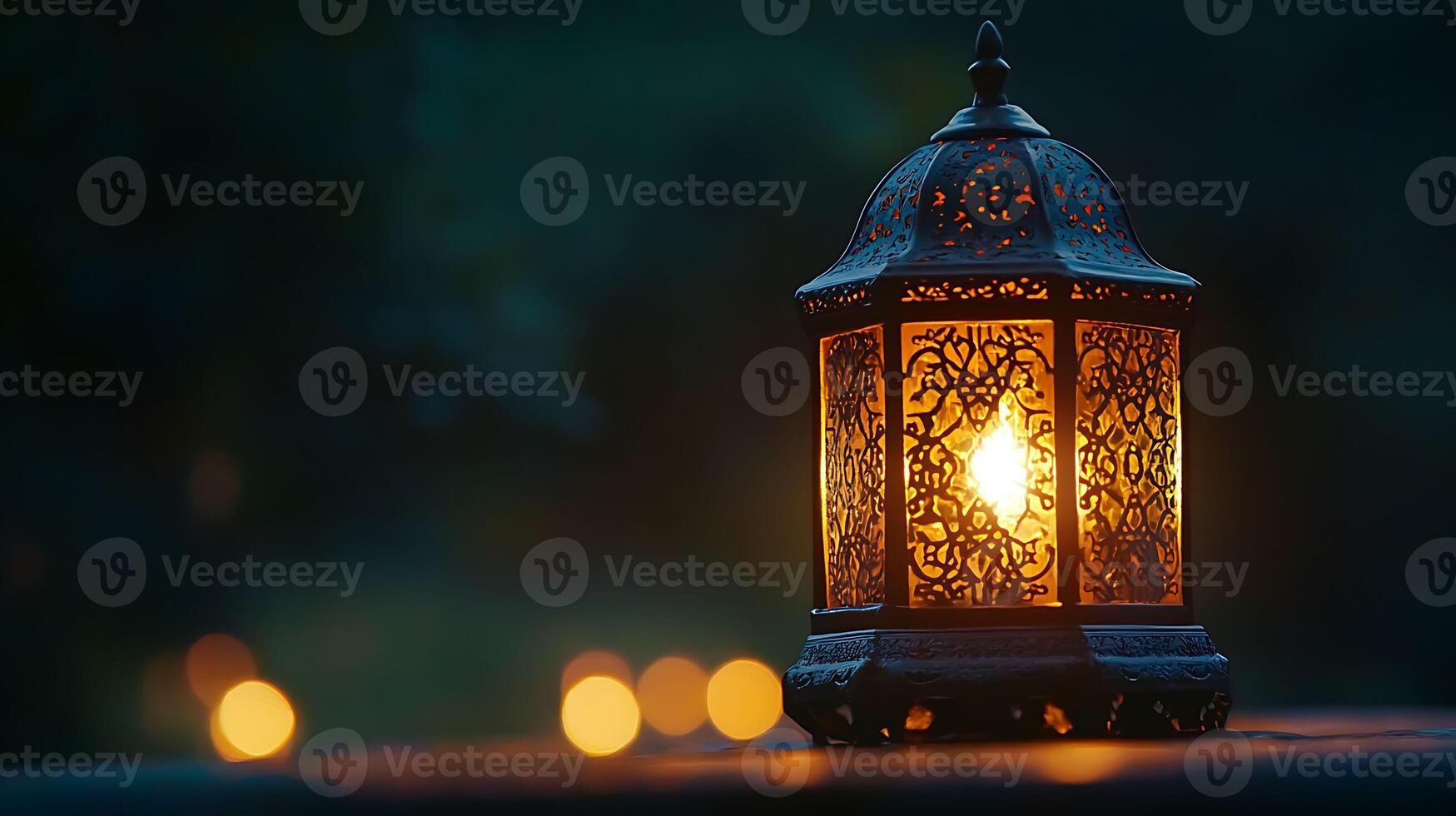 A lantern lit up on a table photo