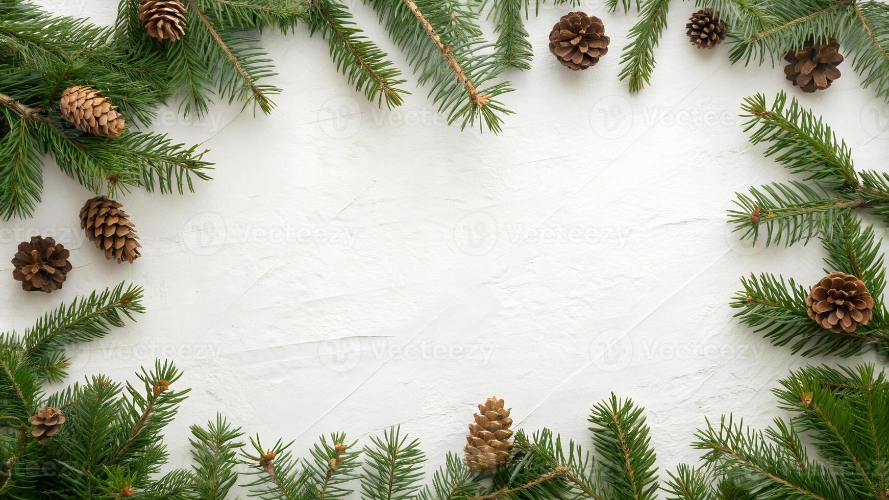 Snowy Holiday Background with Green Pine Branches and Pinecones photo