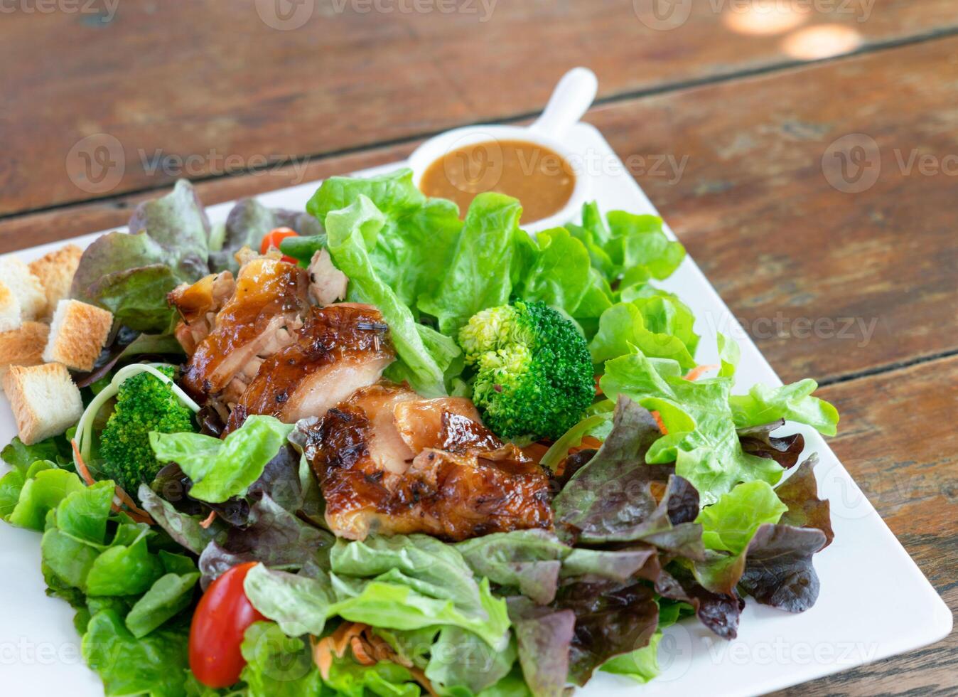 Grilled chicken salad with vegetables. Diet food photo