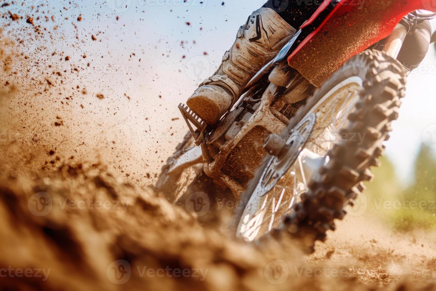 Motocross bike in action, dirt flying high, showcasing power and speed on the off-road track photo