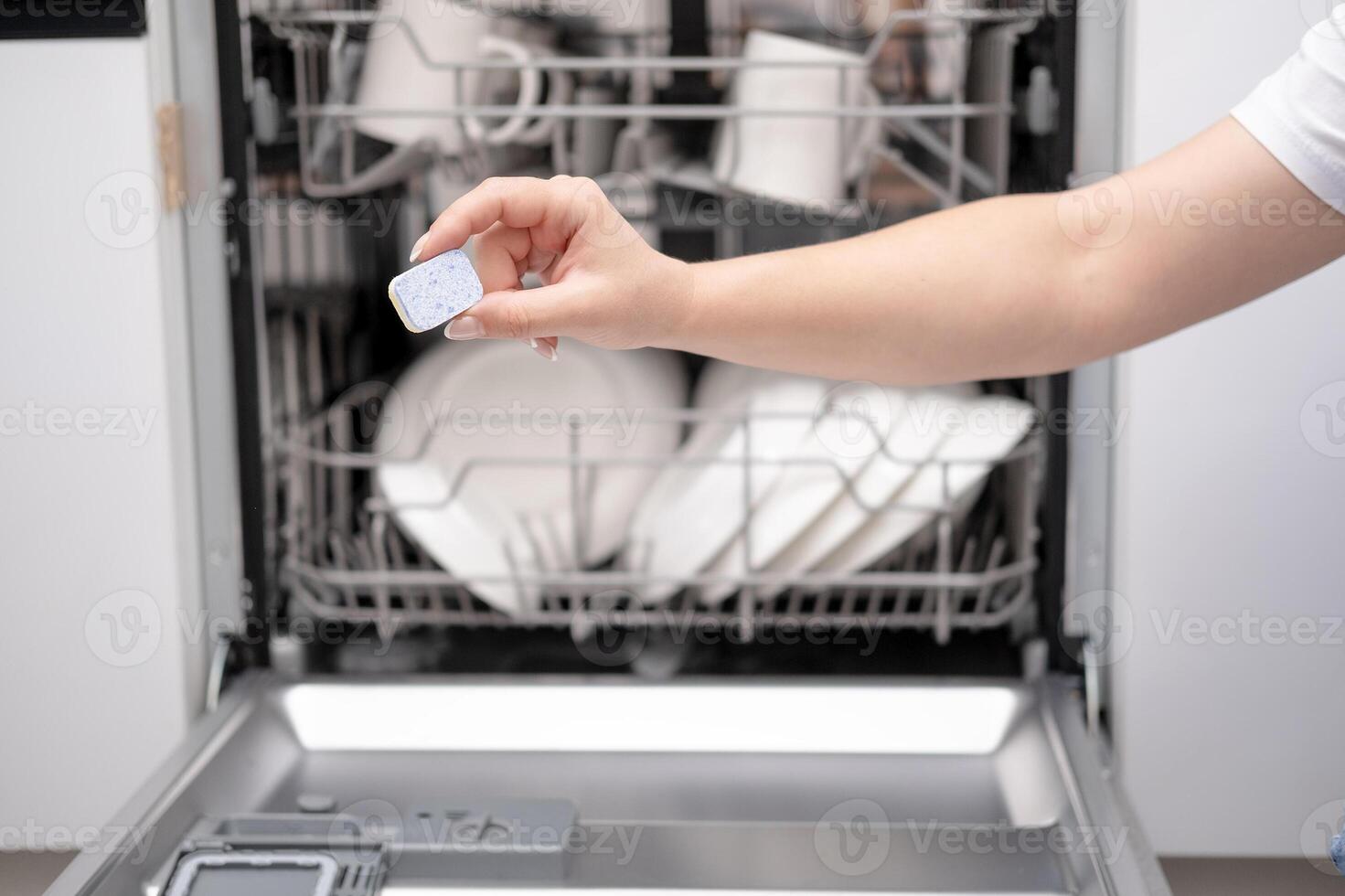 dishwasher with, clean dishes in the kitchen photo