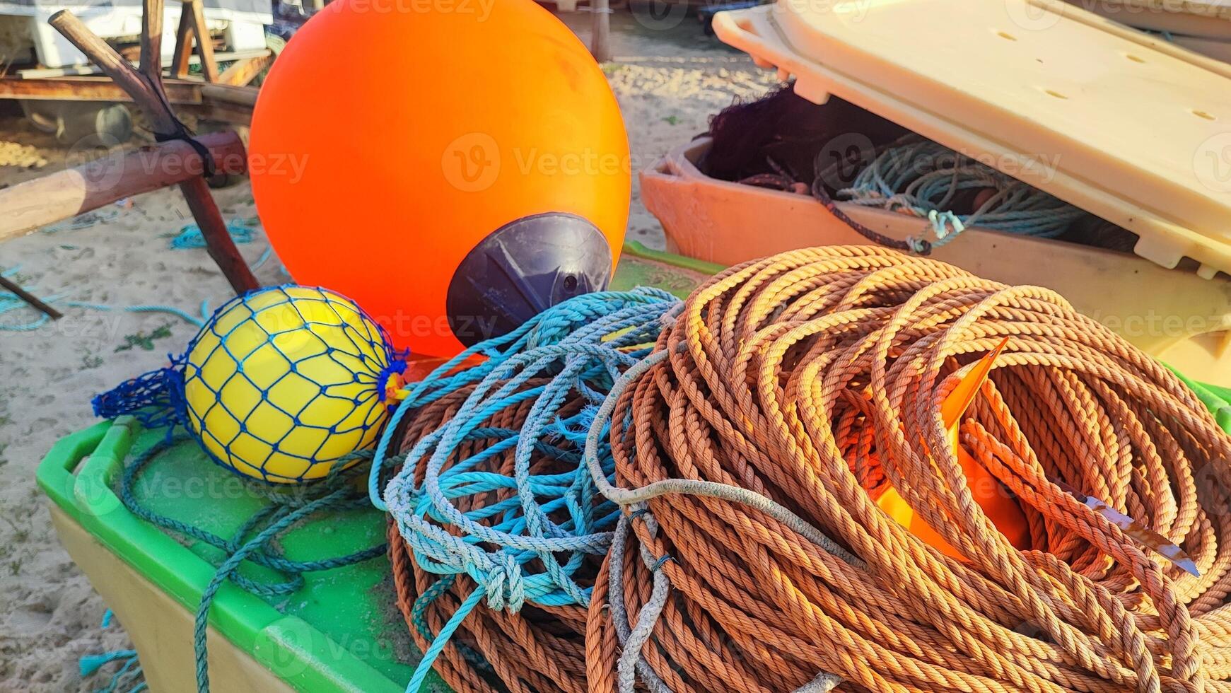 Fishing equipment, boats, on the Atlantic coast in Portugal. Fishing trash on the ocean beach. photo