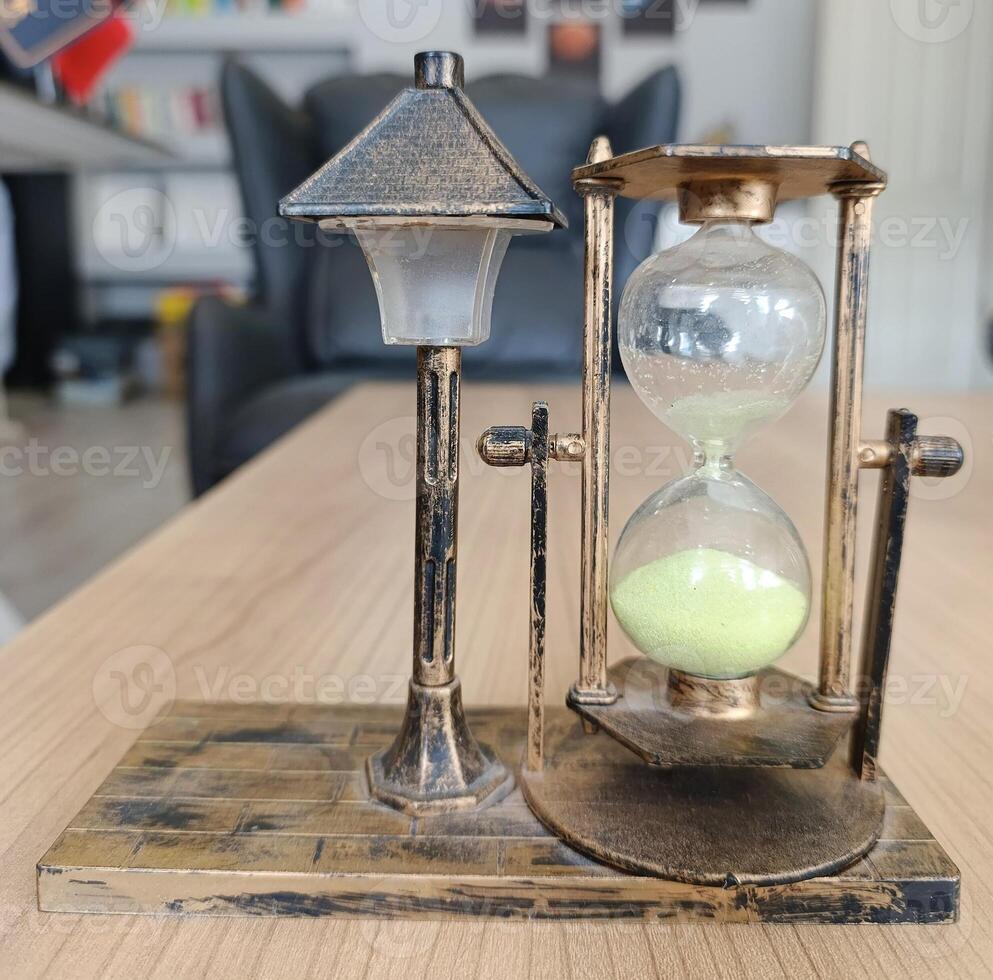 flow of time. hourglass on the table photo