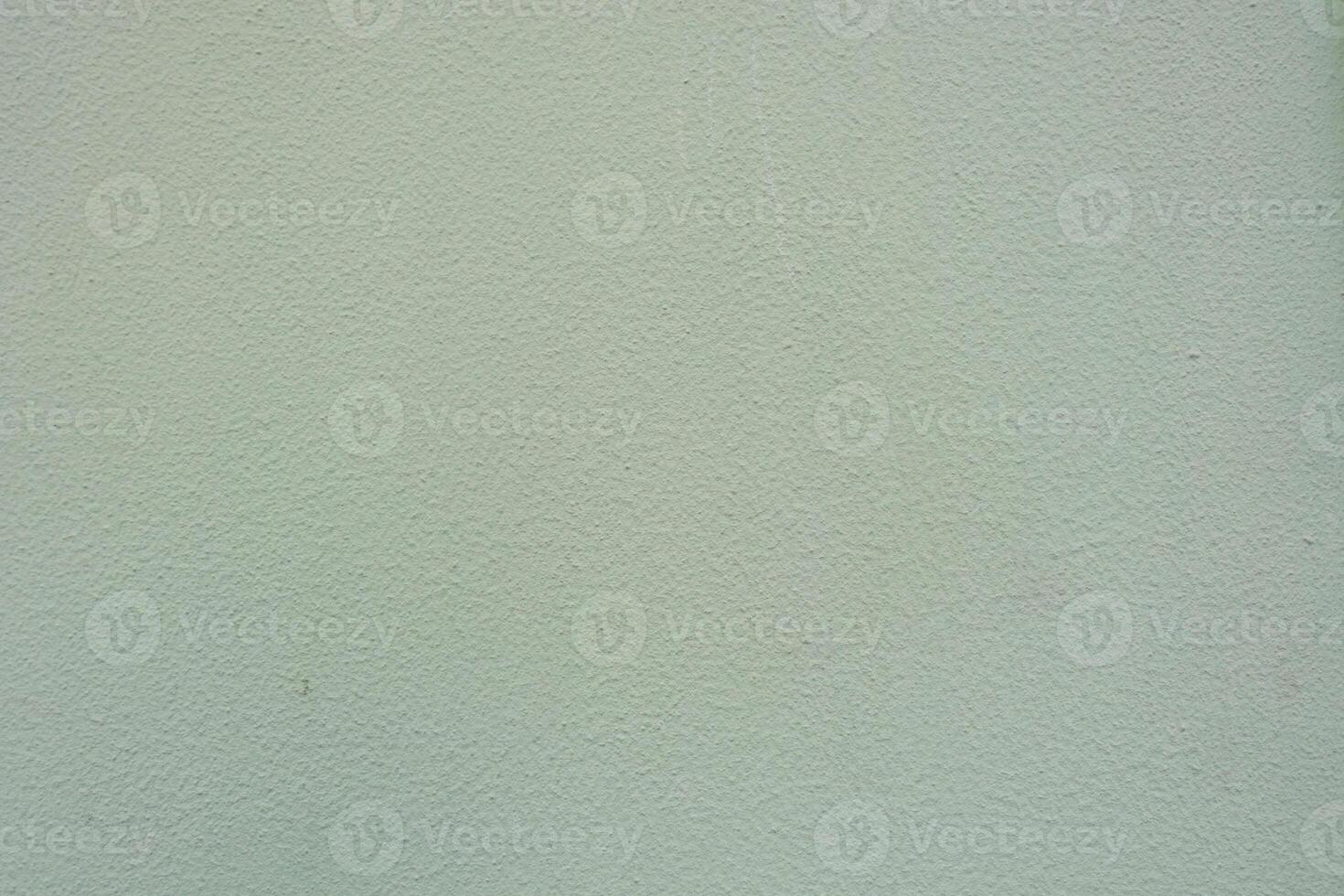 Textured wall with subtle color variations in indoor space photo