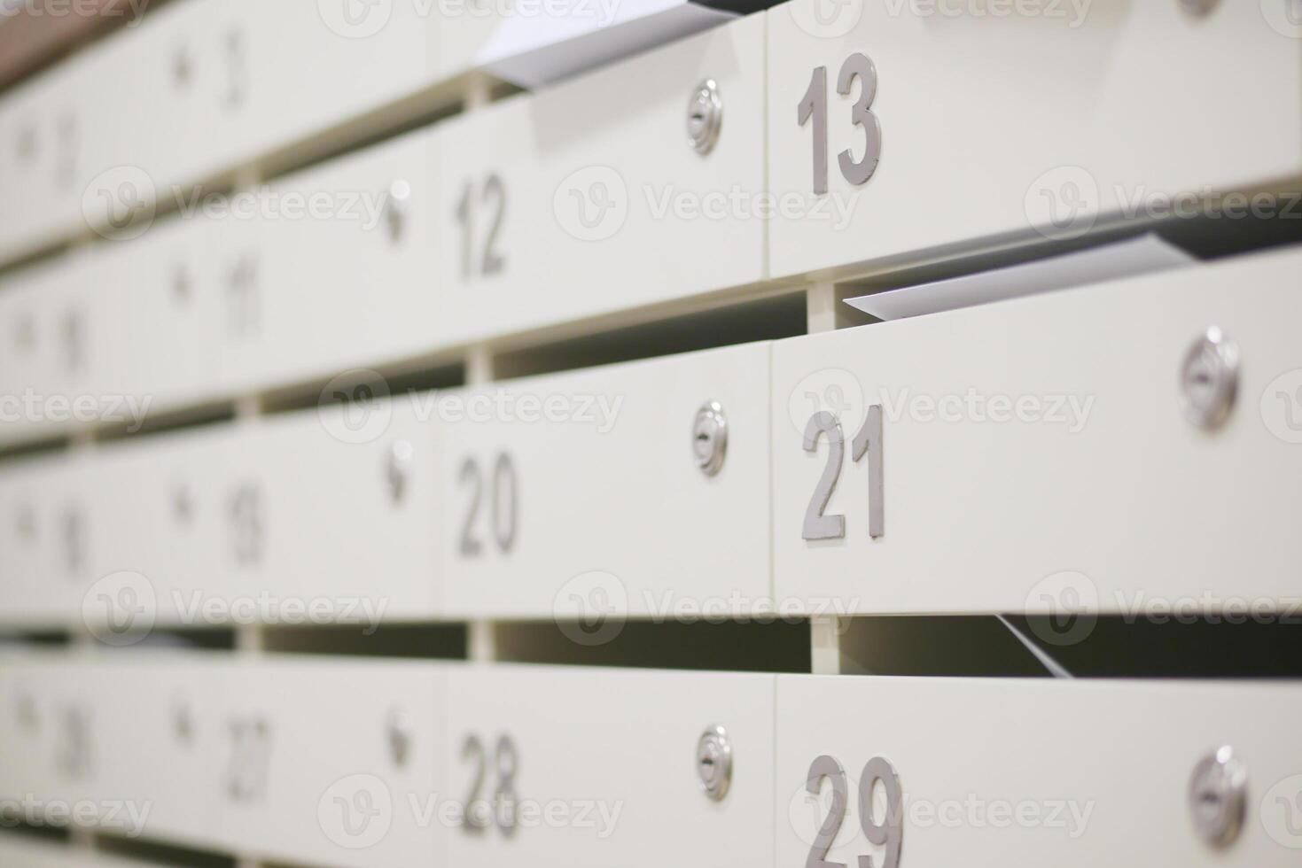 Mailbox units holding letters in a modern office environment photo