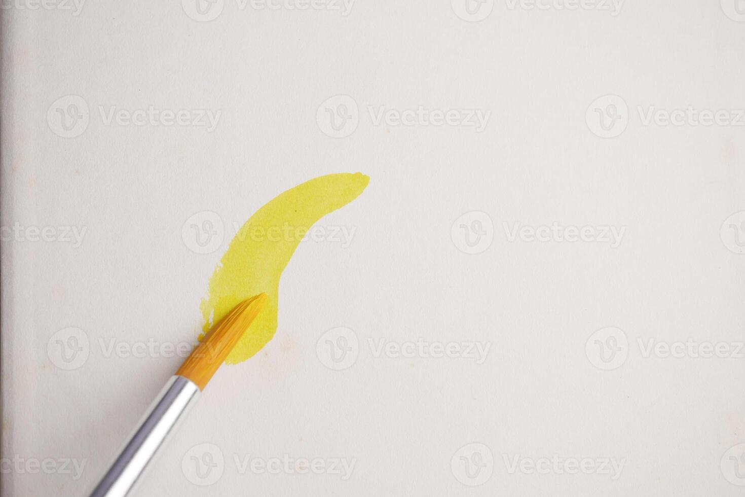 Creating a vibrant yellow stroke on a blank canvas photo