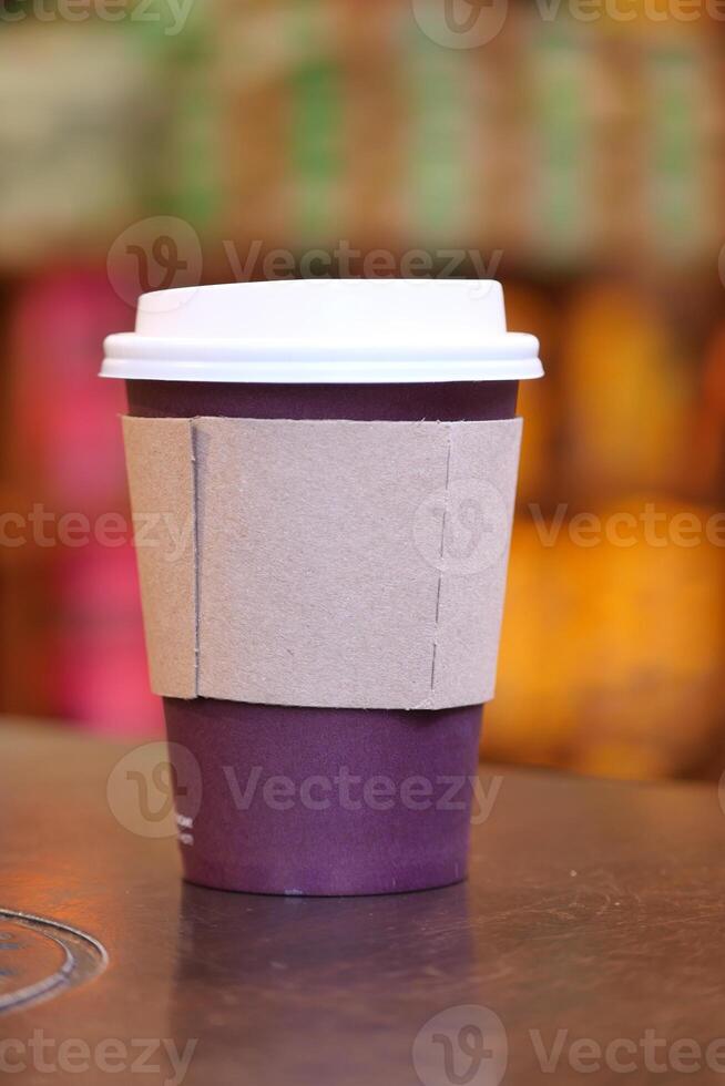 Coffee cup on a table in a cozy cafe ambiance photo
