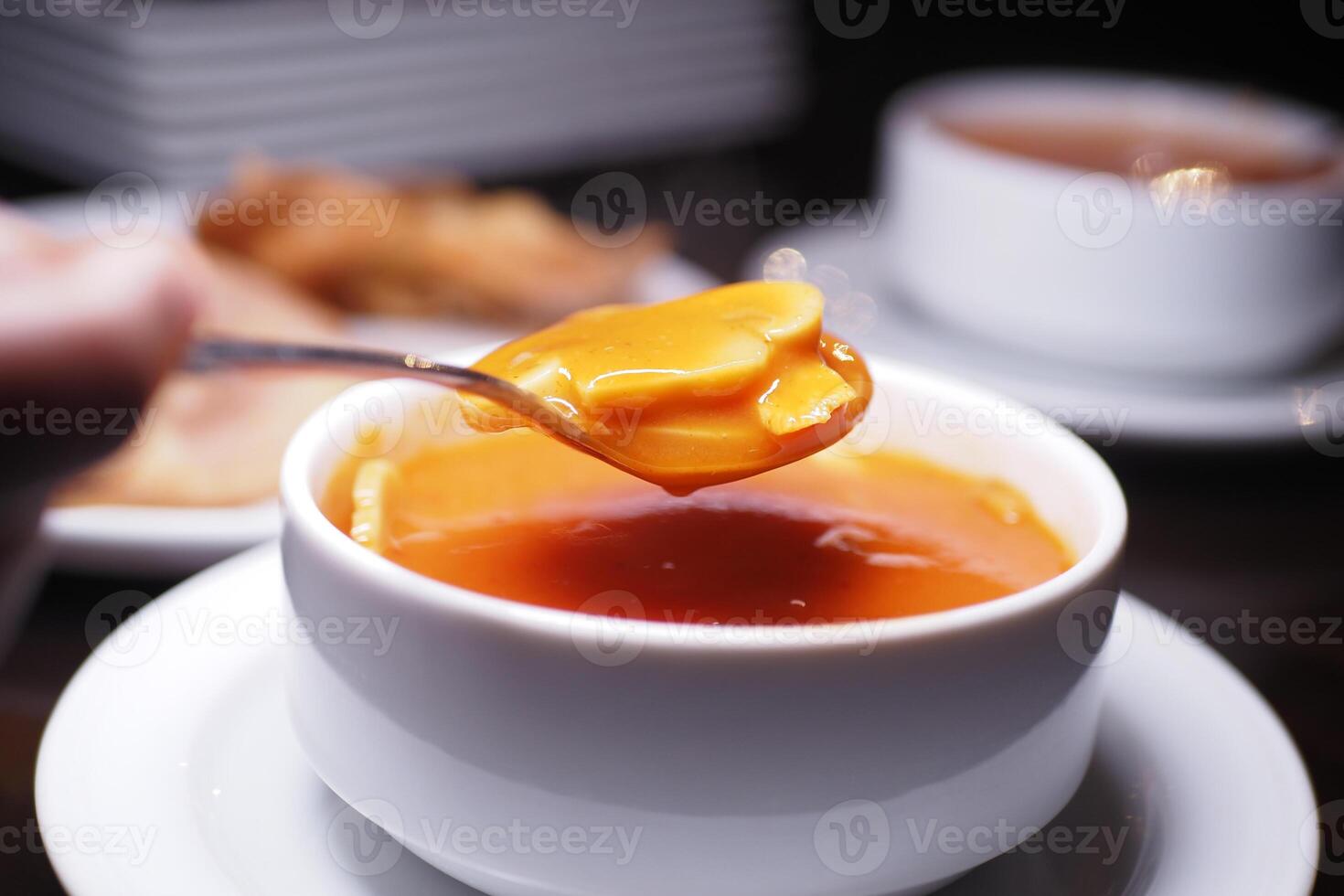 Savoring a rich dessert in a cozy dining setting with tea photo