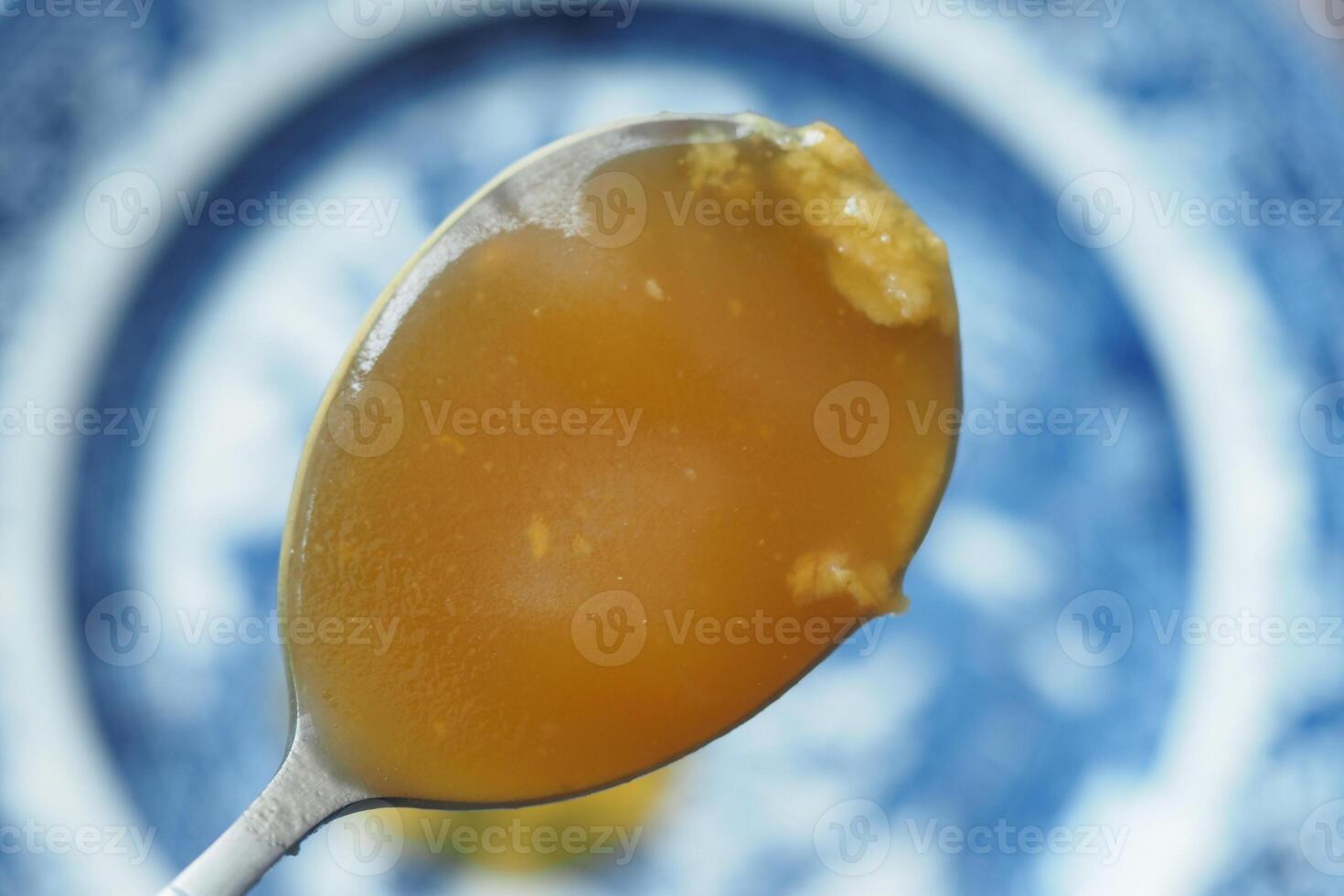 top view of Ghee on a spoon photo