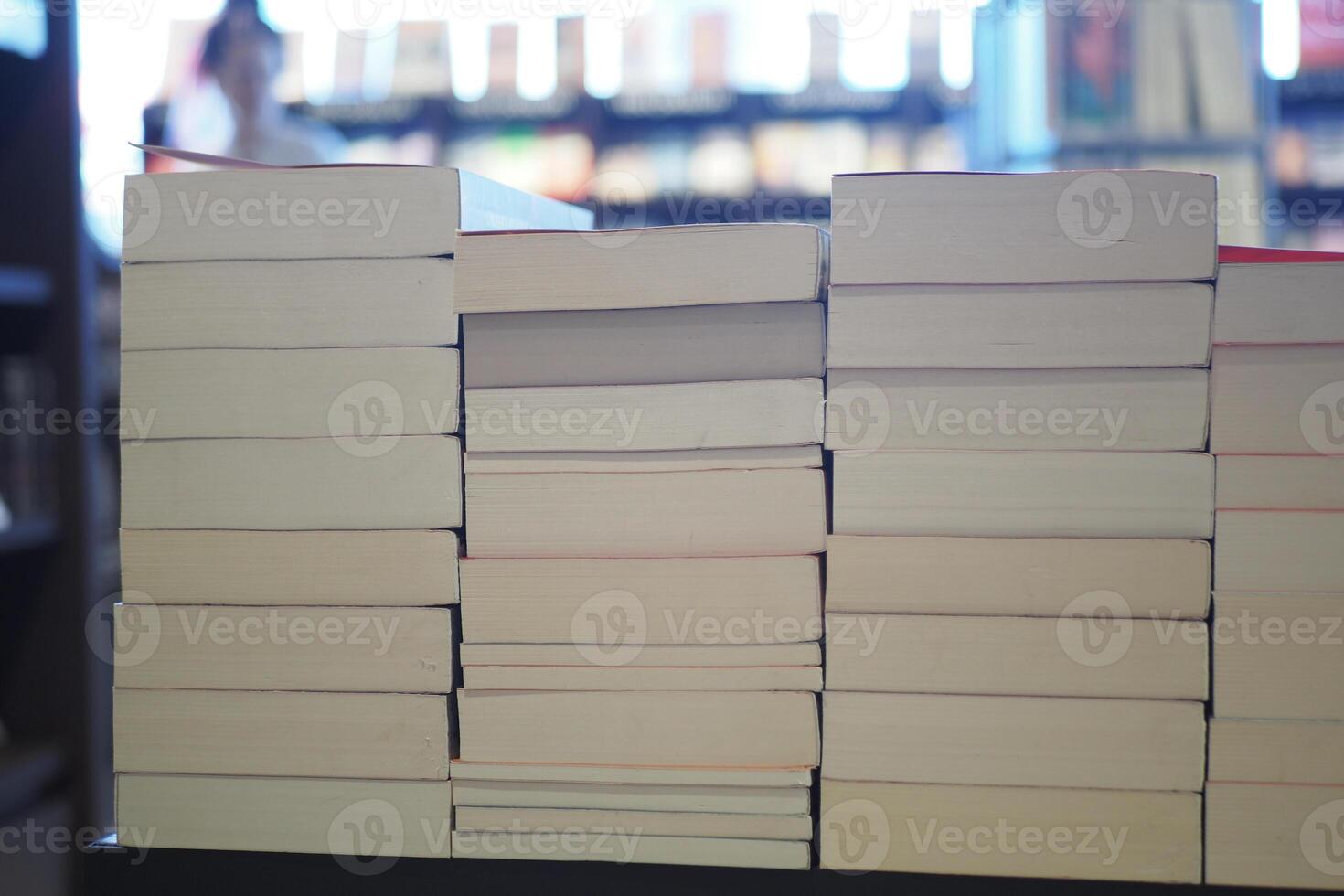 Stack of unmarked books in a cozy reading space photo