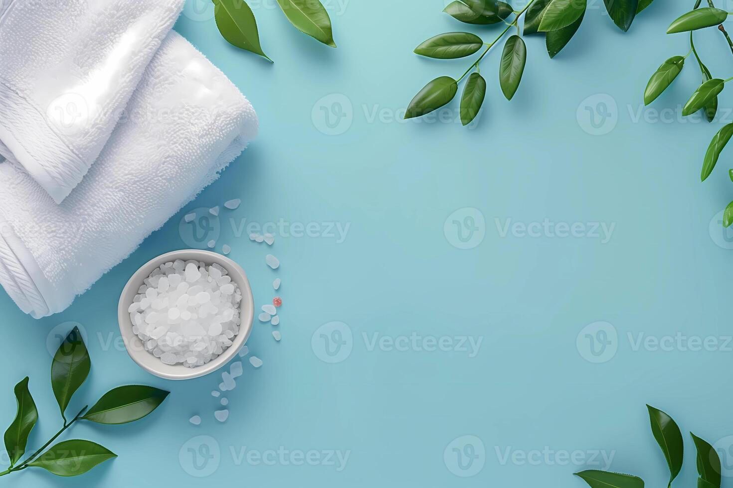 spa towels and salt on a blue background photo