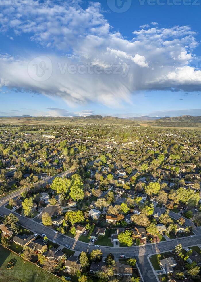 early morning with clouds over Fort Collins and foothills of Rocky Mountains in Colorado, springtime aerial view photo