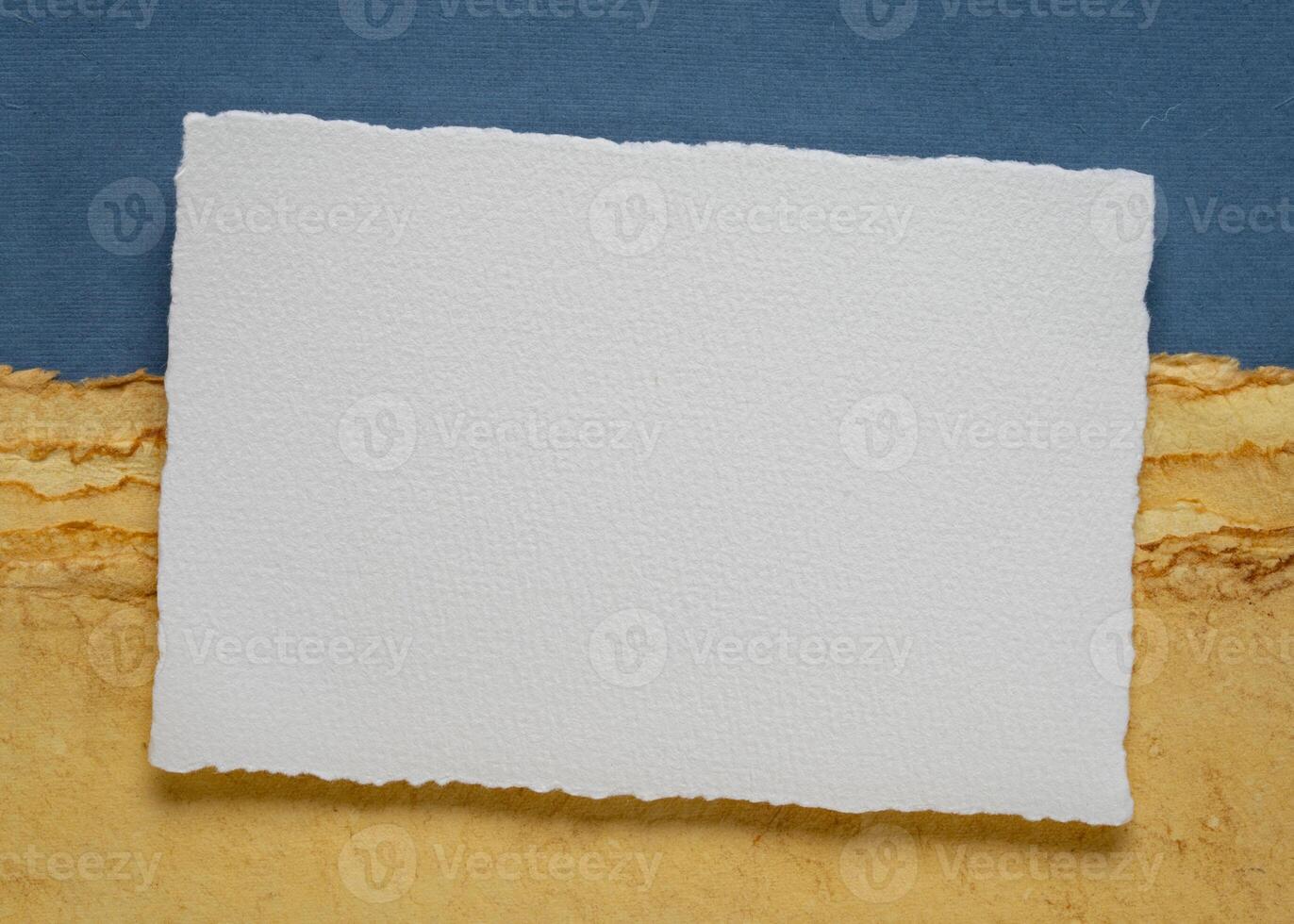 small blank sheet of watercolor paper against abstract art paper landscape photo