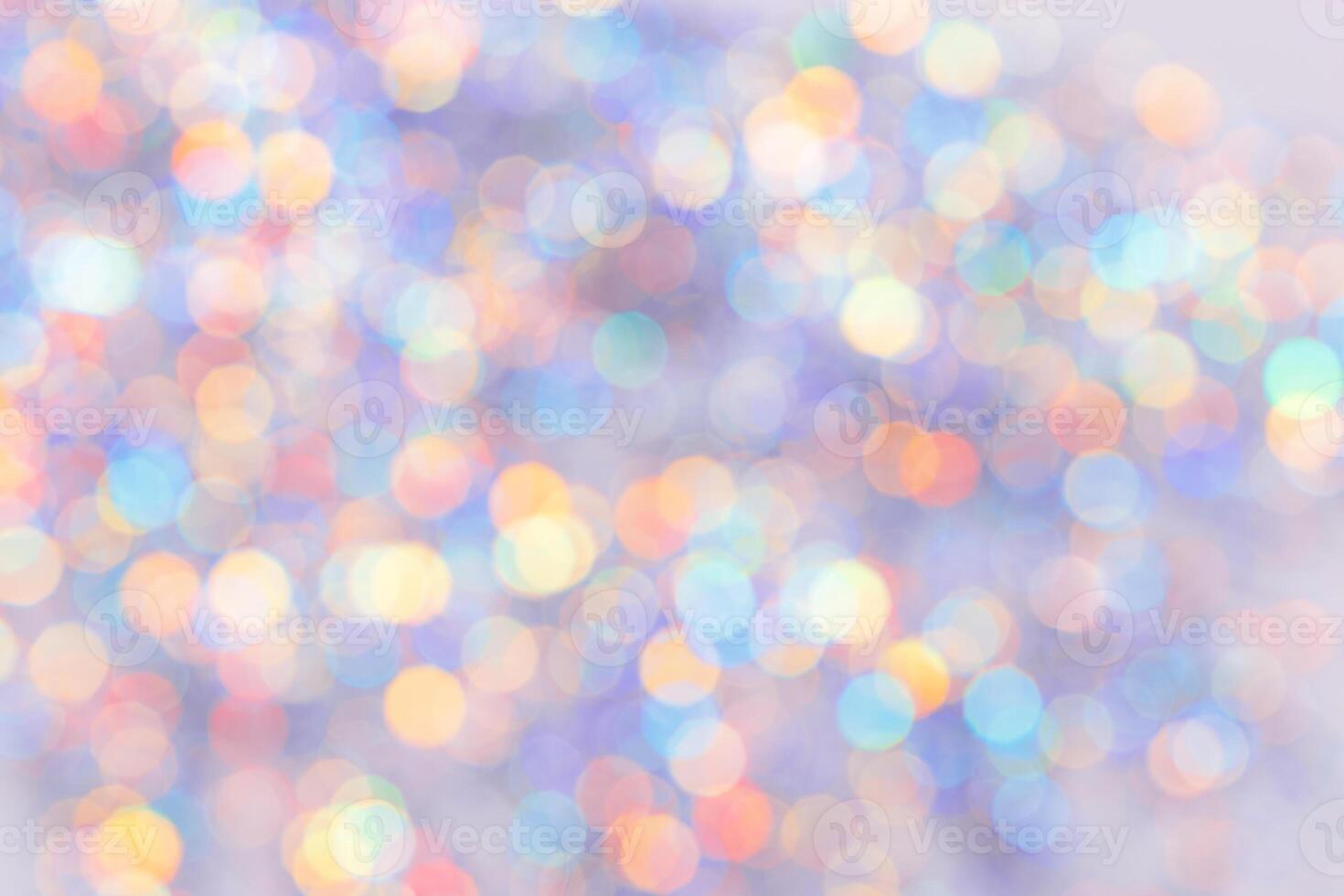 Defocused abstract bokeh background pastel colored, flare from lights, color gradient, blurred circle bokeh as holiday texture. Glittering aesthetic textured lighting pattern photo