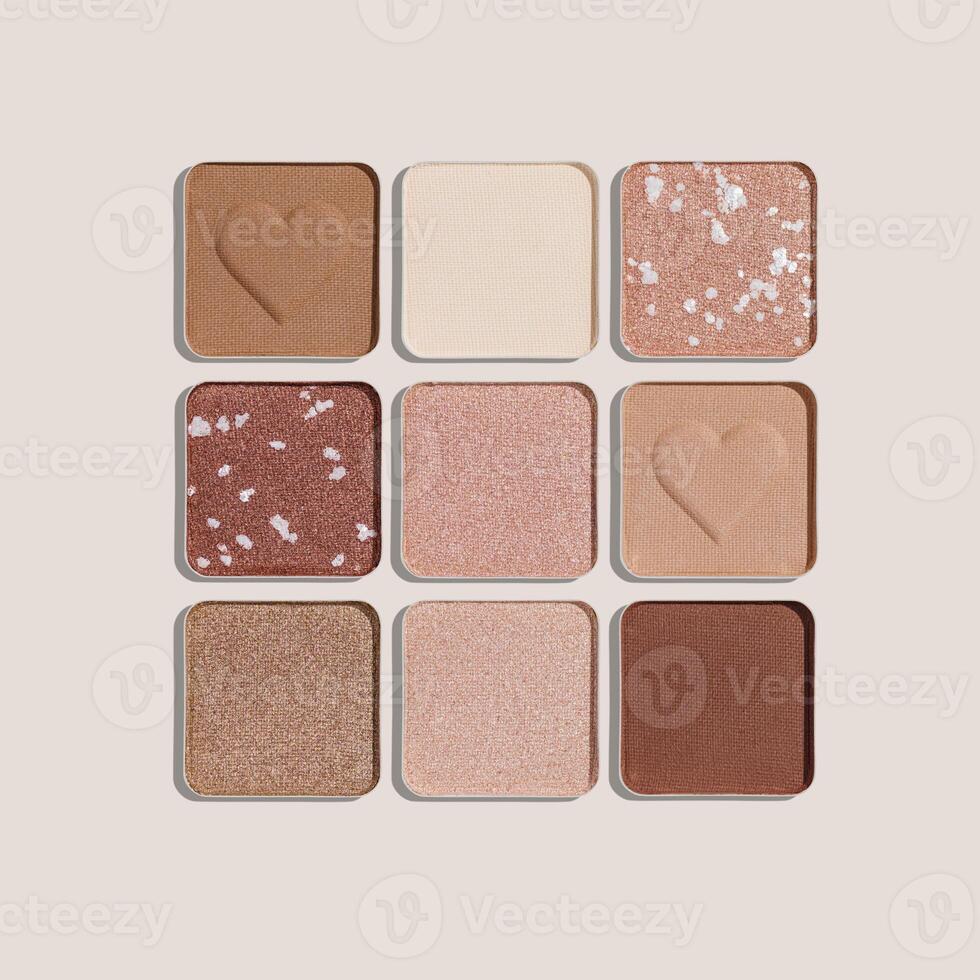 Trend pattern with refill eye shadow swatches, beige brown natural colors on light background. Eyeshadows powder for make up, shiny and matte, minimal aesthetic photo, pastel color, view, flat lay photo