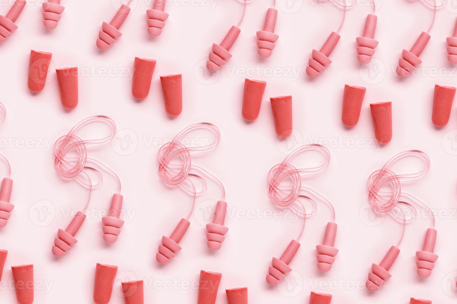Colored earplugs as minimal pattern, reusable silicone and rubber ear plug on cord against noise, protect hear, for swim, sleep, rest. Creative aesthetic flat lay, above view, pastel tones photo