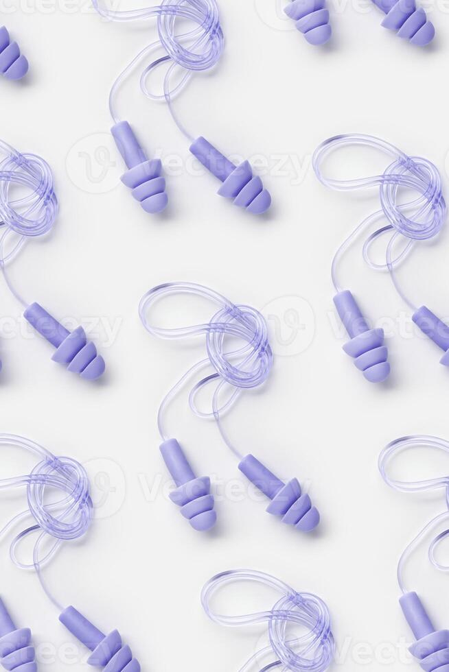 Creative flat lay pattern made purple silicone earplugs for swim, sleep, rest on white background. Comfort ear plug on string against noise, protect hear, top view, visual trends concept photo