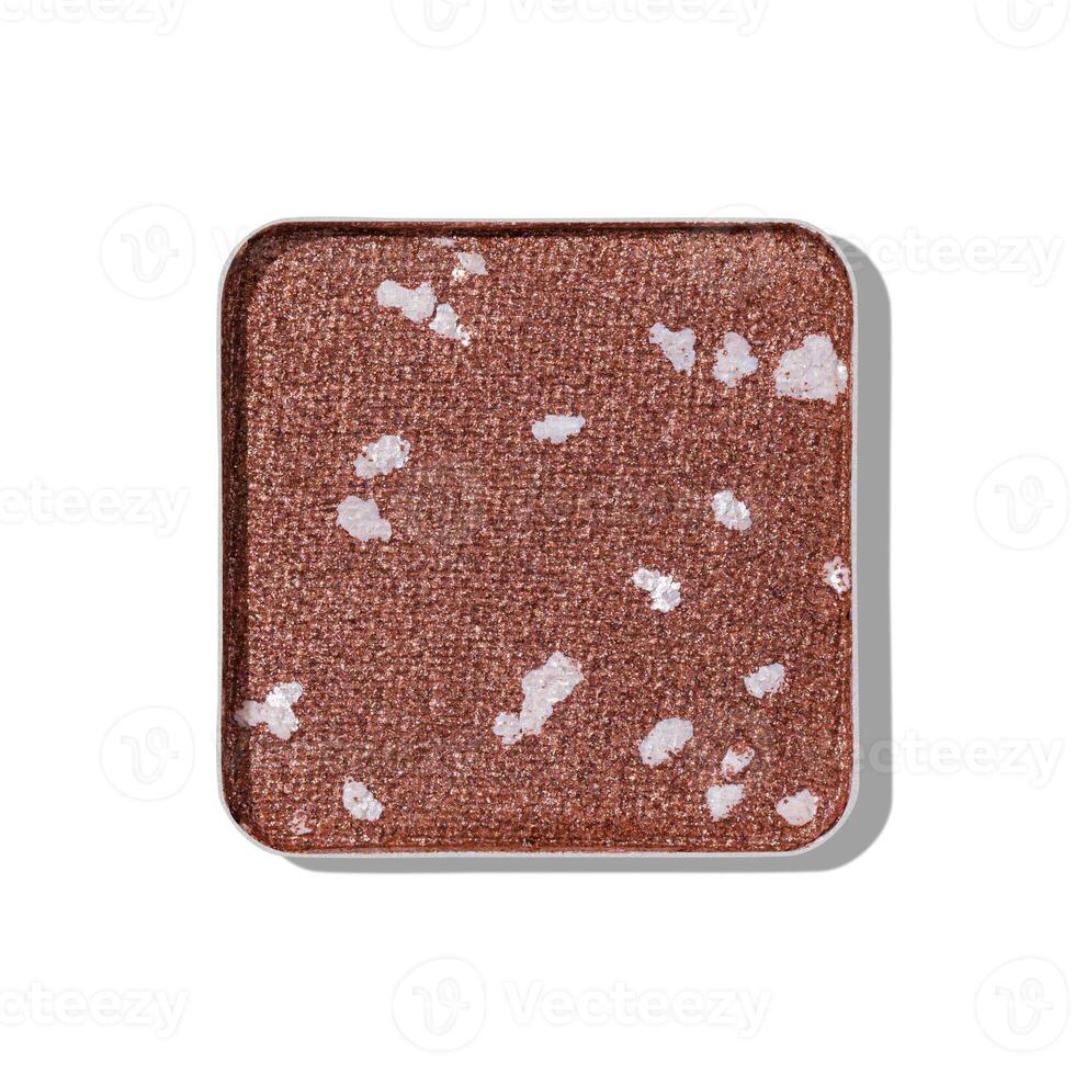 Top view eye shadow glitter beige brown swatch, object isolated on white background with shadow, sparkling eyeshadow, shiny colored powder for festive makeup, square shape pack, beauty texture photo
