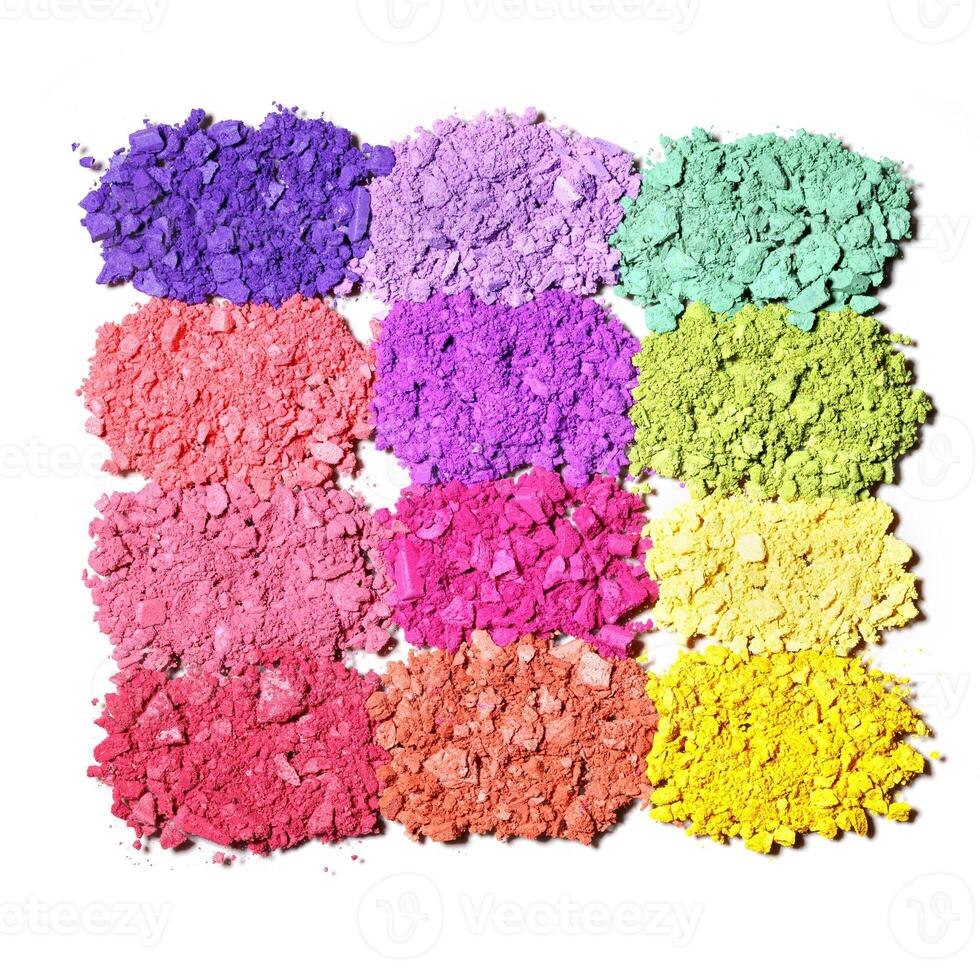 Set of colorful eye shadows, top view crushed swatches of makeup powder, multicolor eyeshadow palette, broken powder texture close up. Female cosmetics and beauty product, isolated on white photo