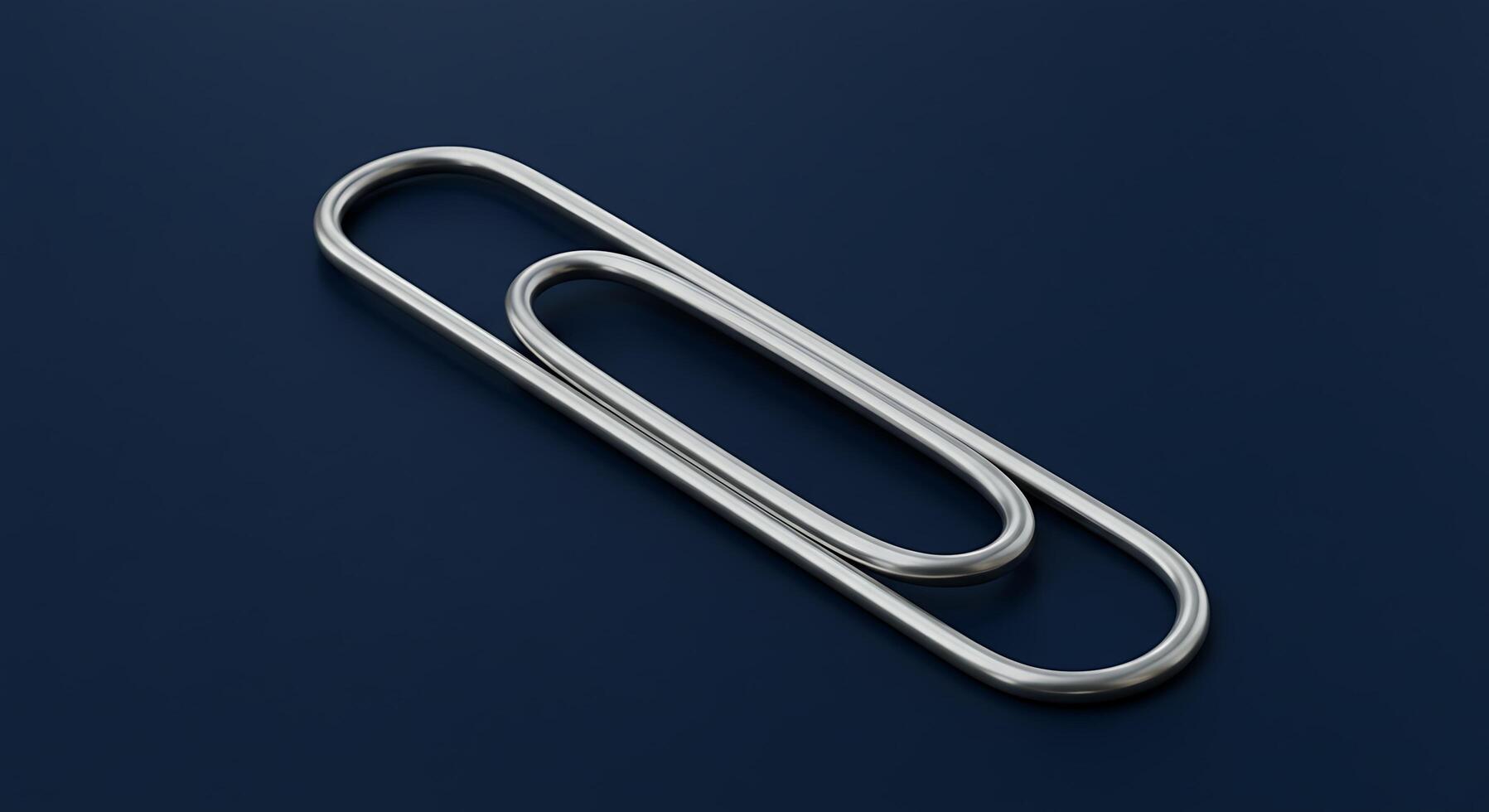 A Detailed CloseUp of a Large Elegant Silver Paperclip on a Deep Blue Background photo